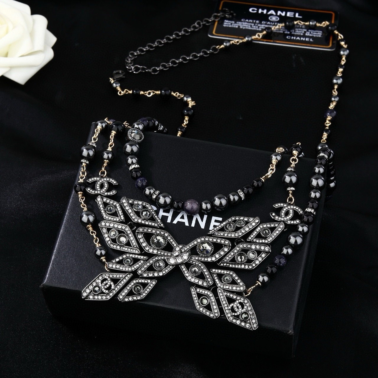 Chanel CC Snowflake Multi-Strand Beaded Chain necklace Gold-tone and gunmetal-tone metal with black beads and clear crystal accents 80cm