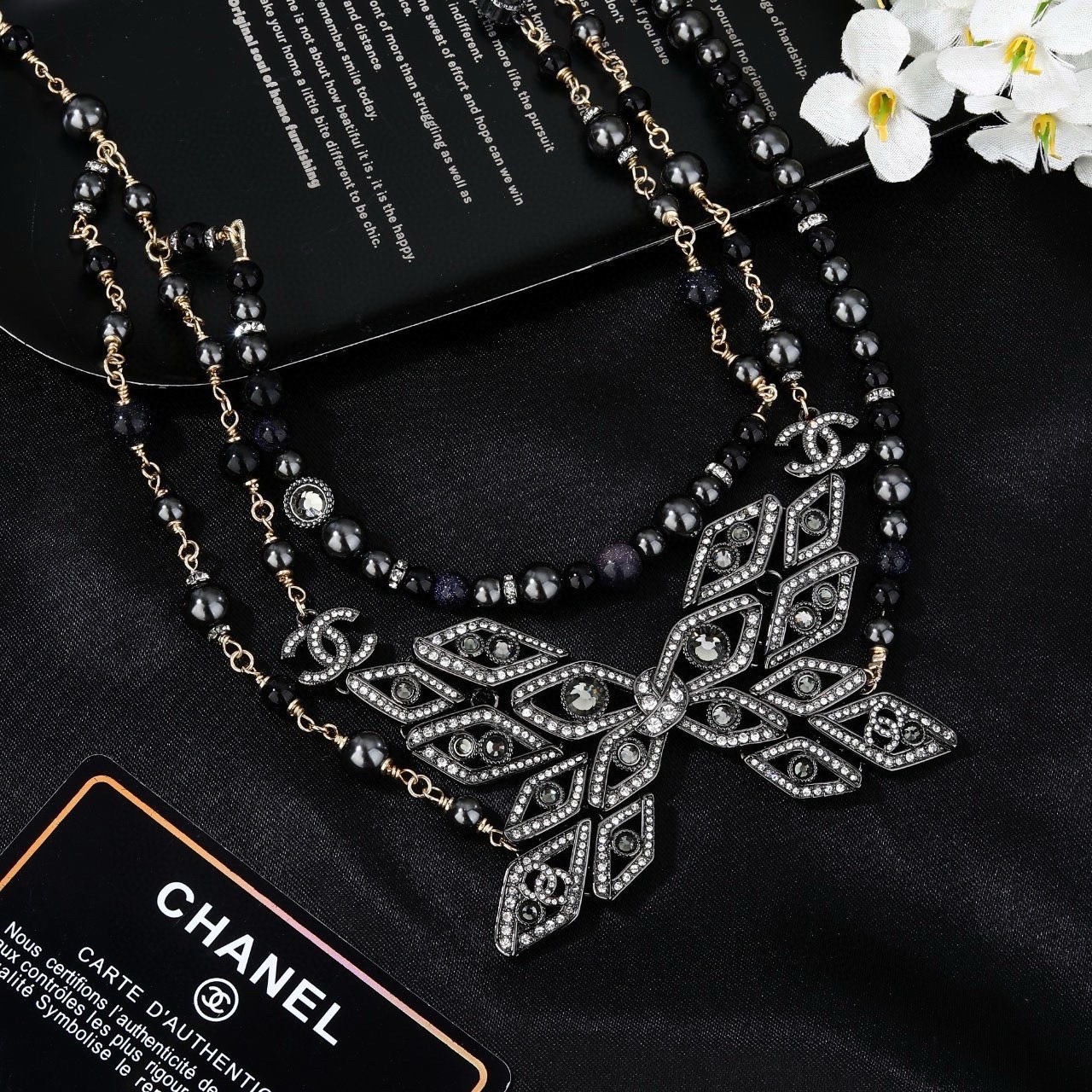 Chanel CC Snowflake Multi-Strand Beaded Chain necklace Gold-tone and gunmetal-tone metal with black beads and clear crystal accents 80cm