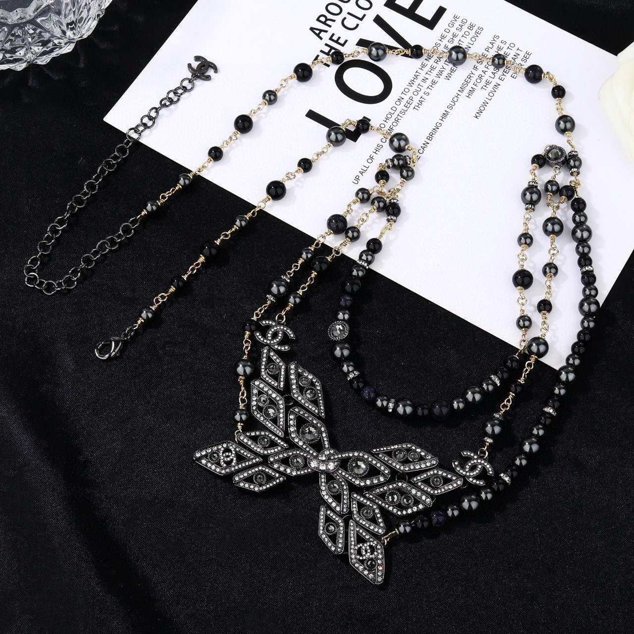 Chanel CC Snowflake Multi-Strand Beaded Chain necklace Gold-tone and gunmetal-tone metal with black beads and clear crystal accents 80cm