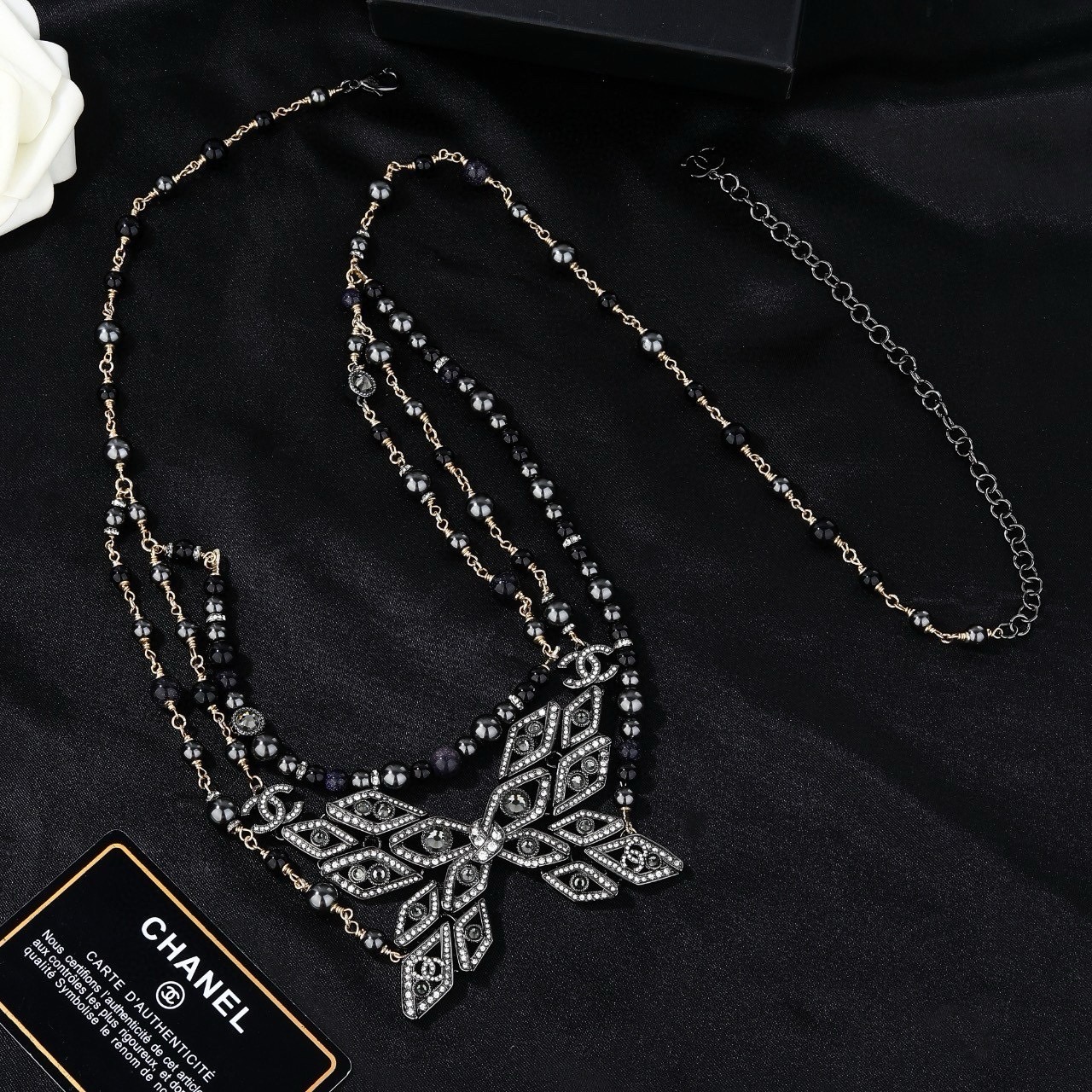 Chanel CC Snowflake Multi-Strand Beaded Chain necklace Gold-tone and gunmetal-tone metal with black beads and clear crystal accents 80cm