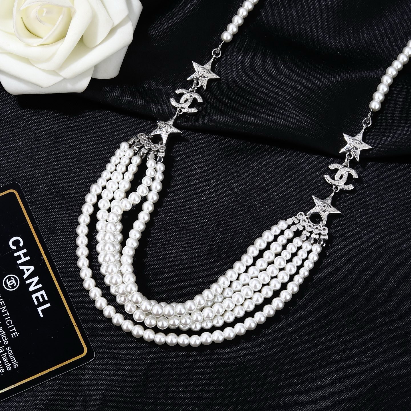 Chanel CC Logo Star Multi-Strand Pearl necklace silver-tone metal white faux pearl clear crystal 42cm with 5cm extender chain