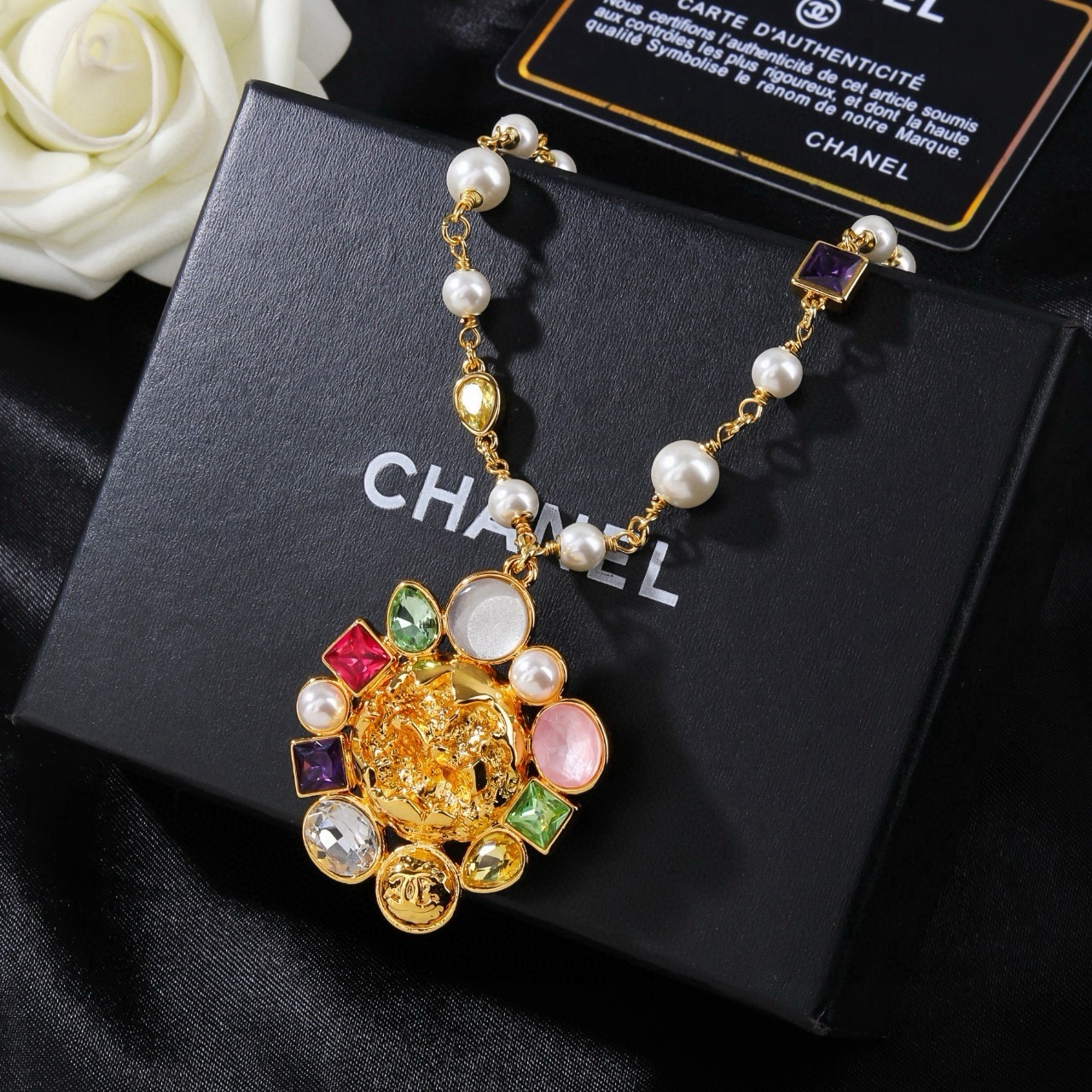 Chanel CC Logo Multicolor Gemstone Pearl Sun Pendant Necklace necklace Gold-tone metal with white pearls purple red green yellow clear pink and white gemstones 60cm