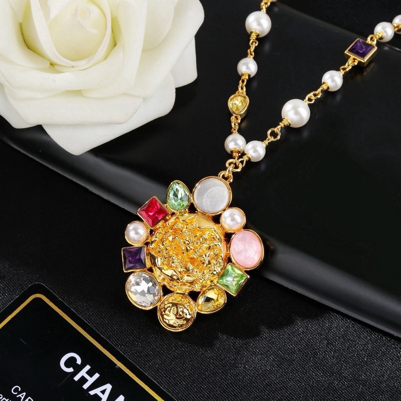 Chanel CC Logo Multicolor Gemstone Pearl Sun Pendant Necklace necklace Gold-tone metal with white pearls purple red green yellow clear pink and white gemstones 60cm