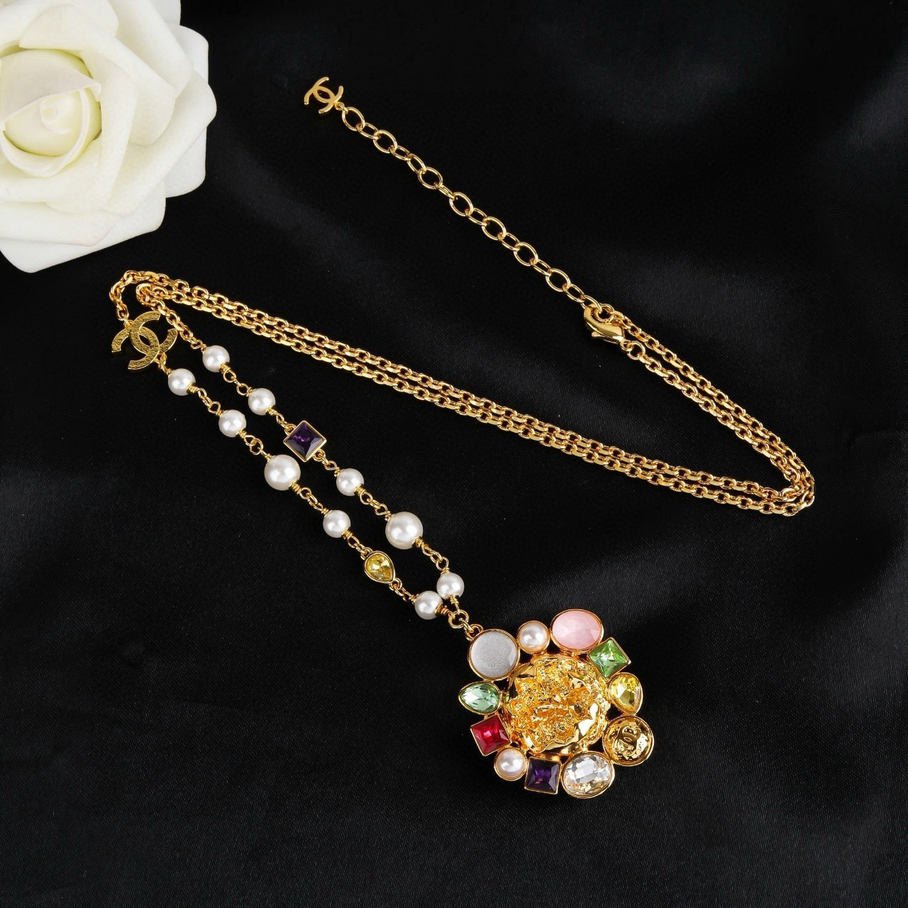 Chanel CC Logo Multicolor Gemstone Pearl Sun Pendant Necklace necklace Gold-tone metal with white pearls purple red green yellow clear pink and white gemstones 60cm