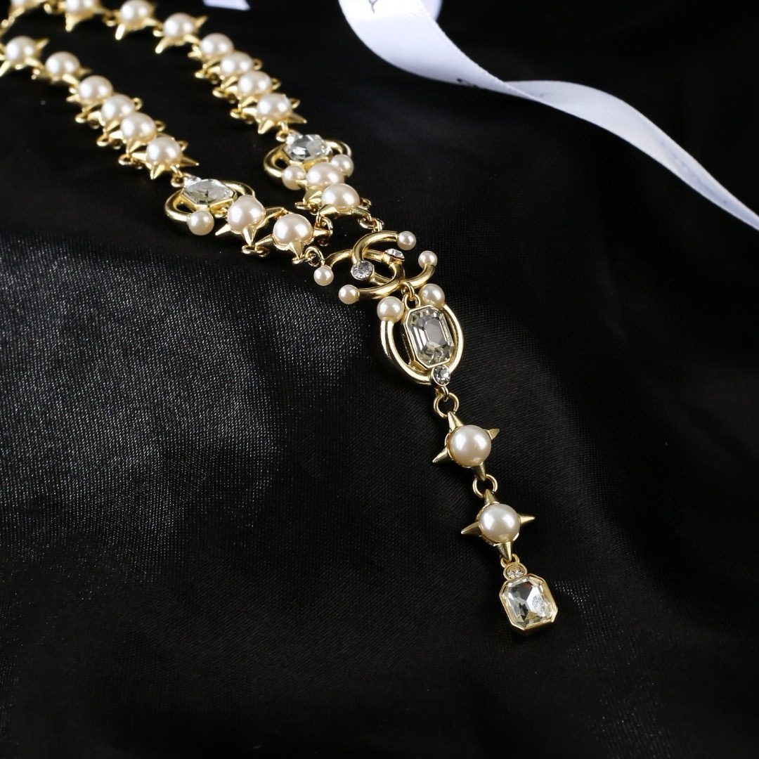 Chanel 2021 CC Logo Star Pearl Crystal Lariat Necklace necklace gold-tone metal white pearl clear crystal 40cm with 5cm extender