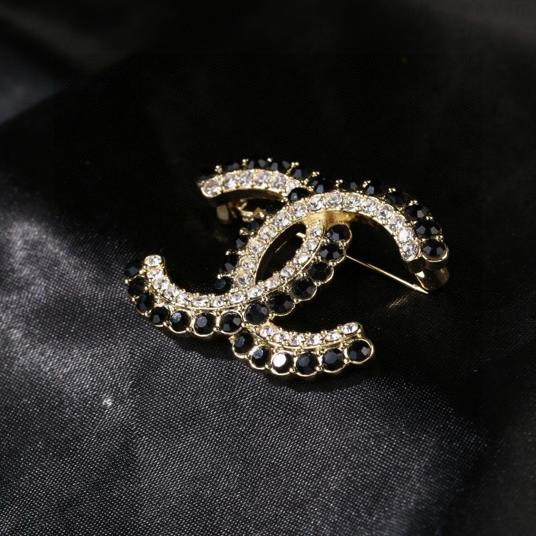 Chanel CC Double C Logo Crystal Brooch brooch gold-tone metal with clear crystals and black faceted stones 3 5cm width