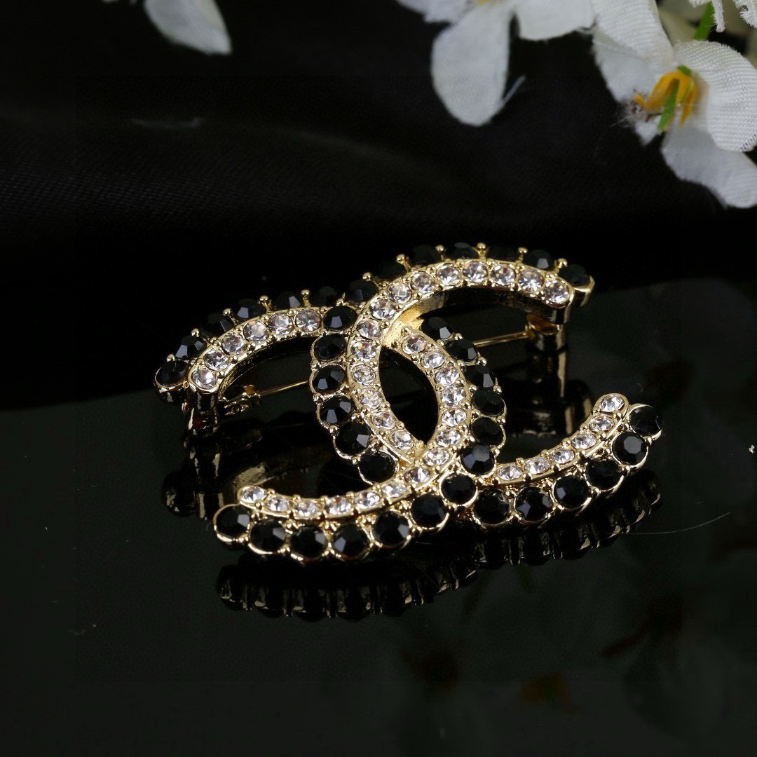Chanel CC Double C Logo Crystal Brooch brooch gold-tone metal with clear crystals and black faceted stones 3 5cm width