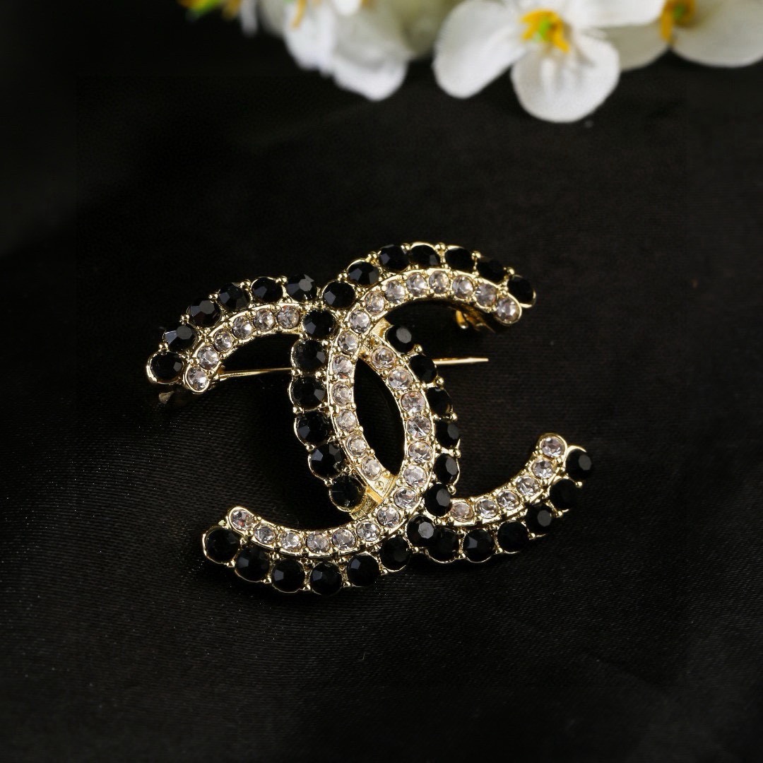 Chanel CC Double C Logo Crystal Brooch brooch gold-tone metal with clear crystals and black faceted stones 3 5cm width