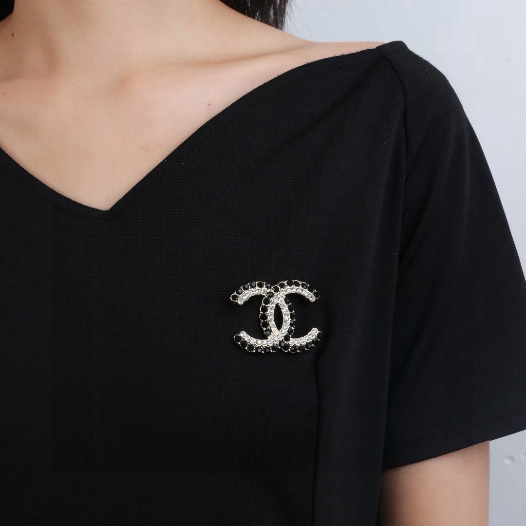 Chanel CC Double C Logo Crystal Brooch brooch gold-tone metal with clear crystals and black faceted stones 3 5cm width