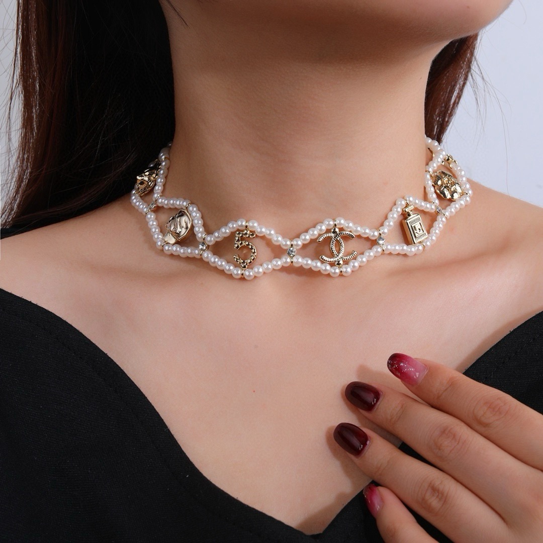 Chanel CC Logo No 5 Camellia Charm Pearl Choker necklace Gold-tone metal white faux pearl clear crystal 38cm with 5cm extender