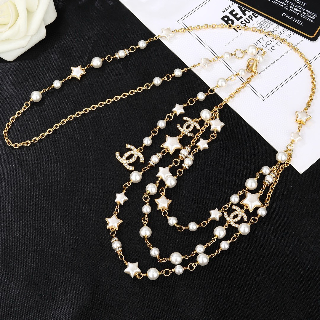 Chanel Goose Star CC Pearl Multi-Strand Waist Chain necklace Gold-tone metal white faux pearl white enamel star clear crystal 80cm