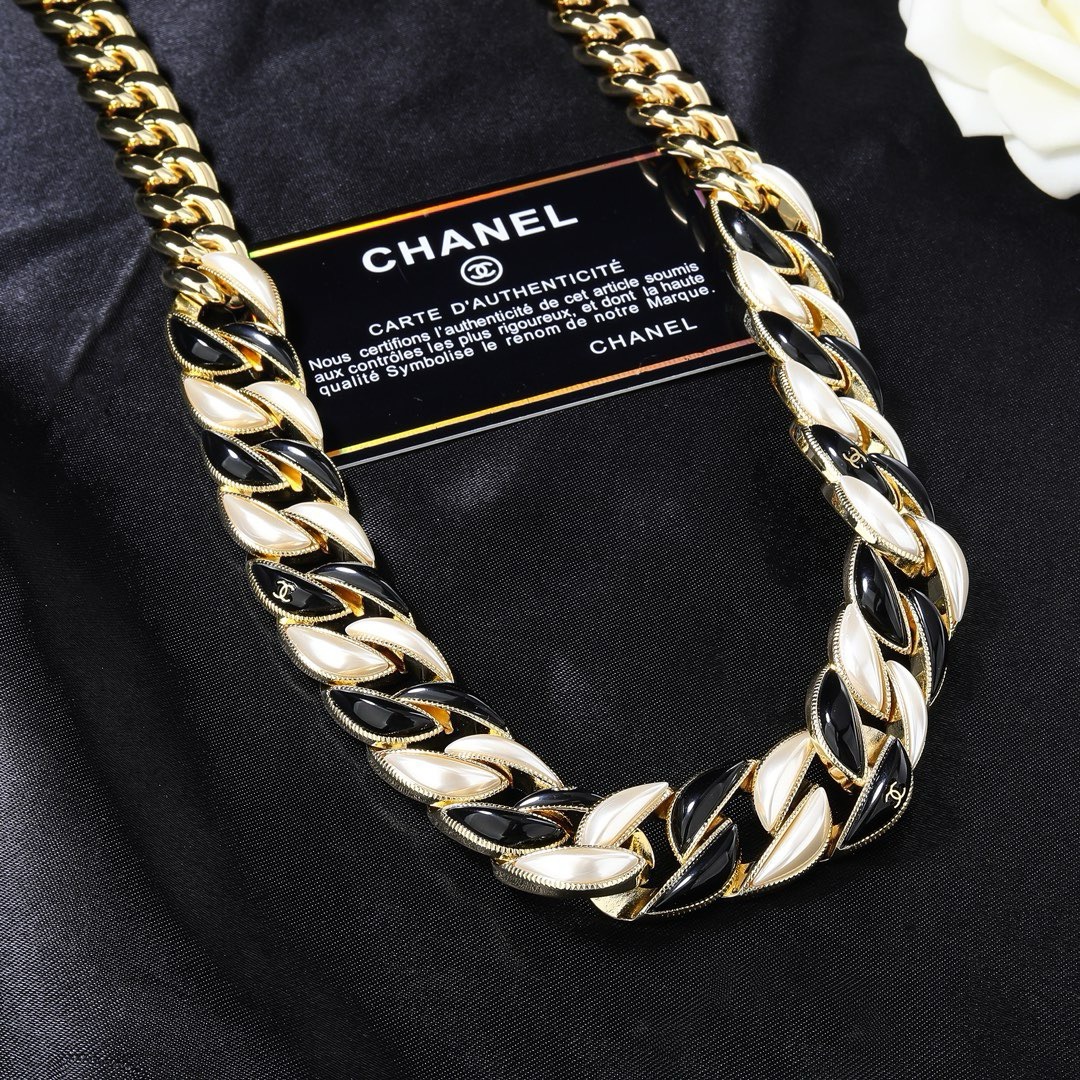 Chanel CC Logo Curb Chain necklace Gold-tone metal with black enamel and pearlescent white accents Adjustable 40-45cm