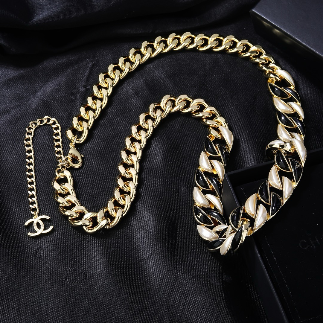 Chanel CC Logo Curb Chain necklace Gold-tone metal with black enamel and pearlescent white accents Adjustable 40-45cm