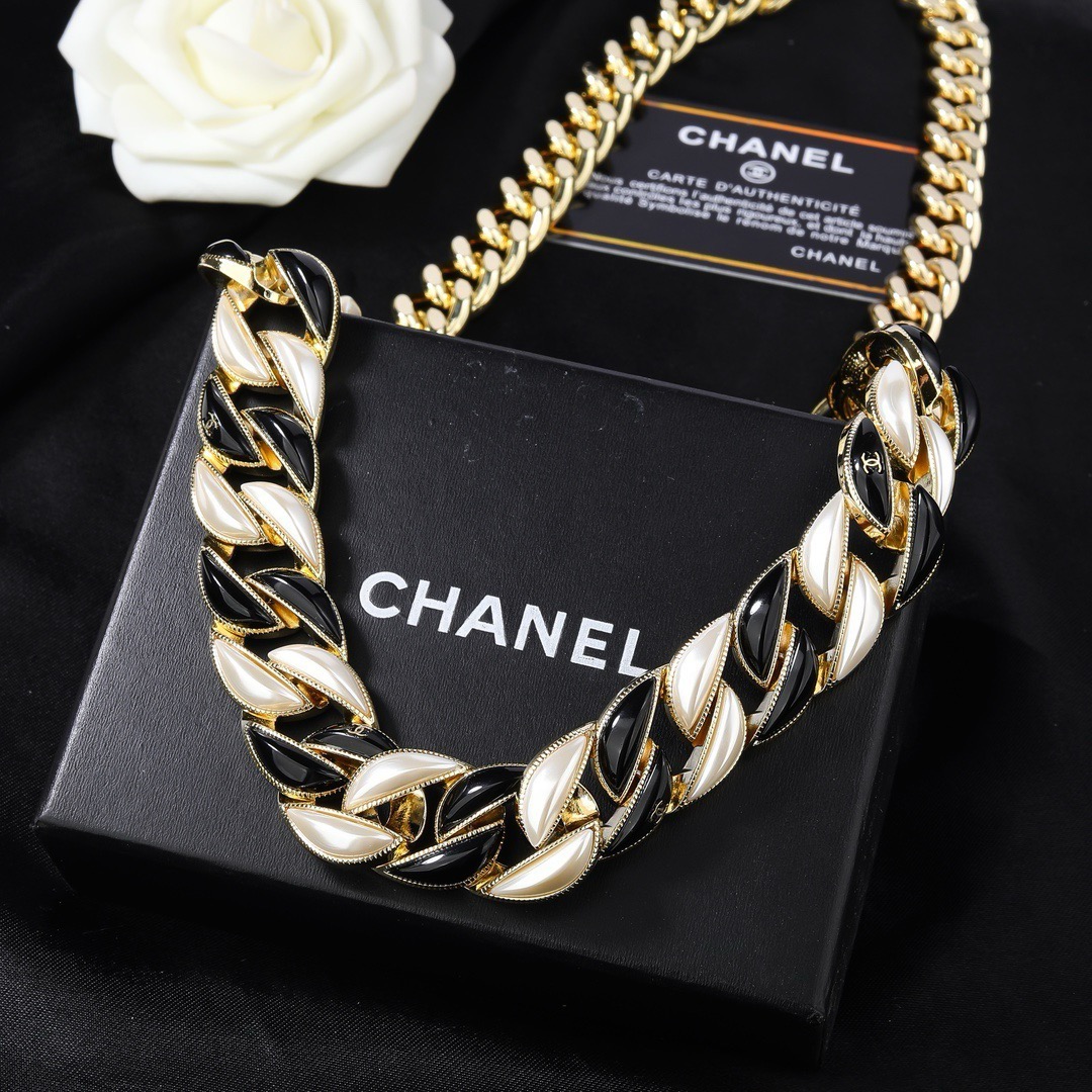 Chanel CC Logo Curb Chain necklace Gold-tone metal with black enamel and pearlescent white accents Adjustable 40-45cm