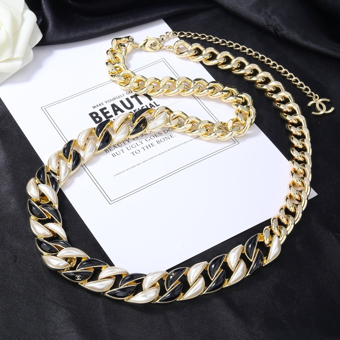 Chanel CC Logo Curb Chain necklace Gold-tone metal with black enamel and pearlescent white accents Adjustable 40-45cm