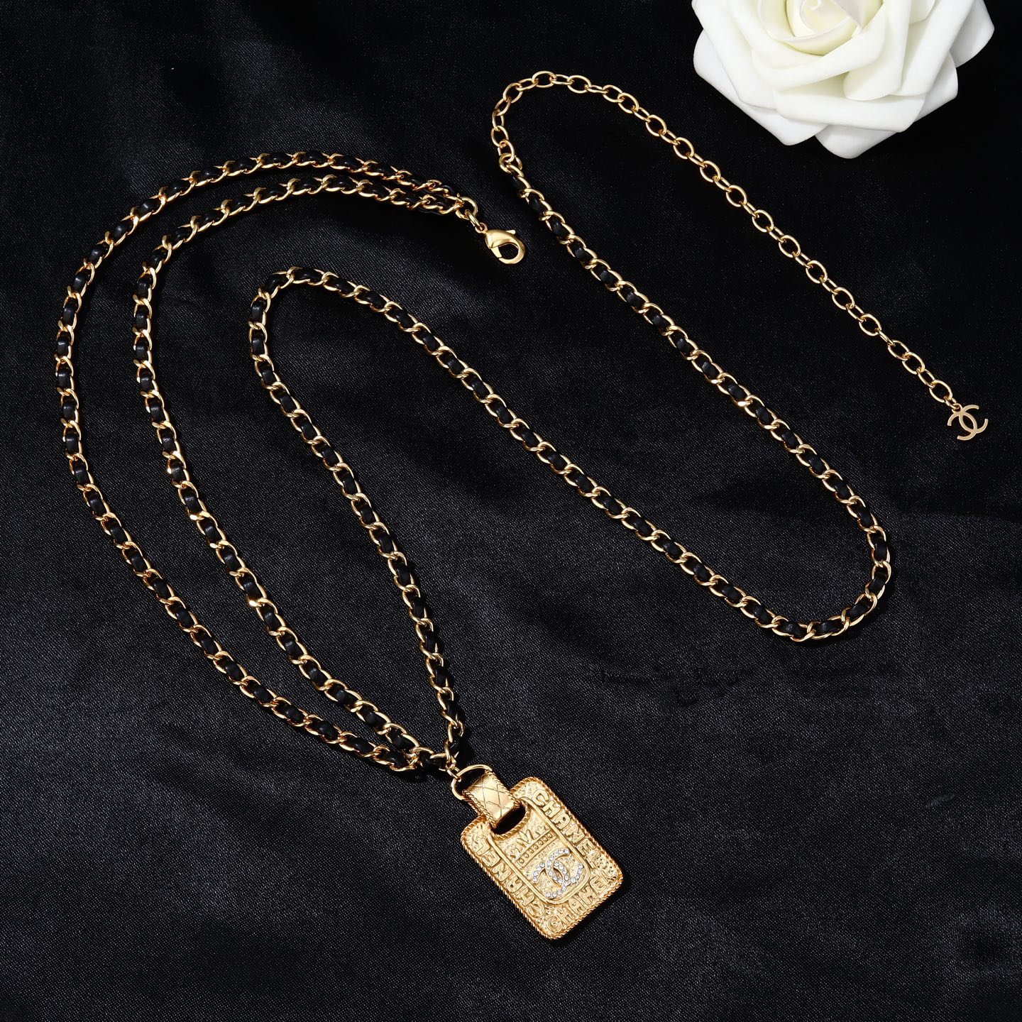Chanel Goose series necklace gold-tone metal with black leather woven chain clear crystal accents on gold-tone pendant 80cm