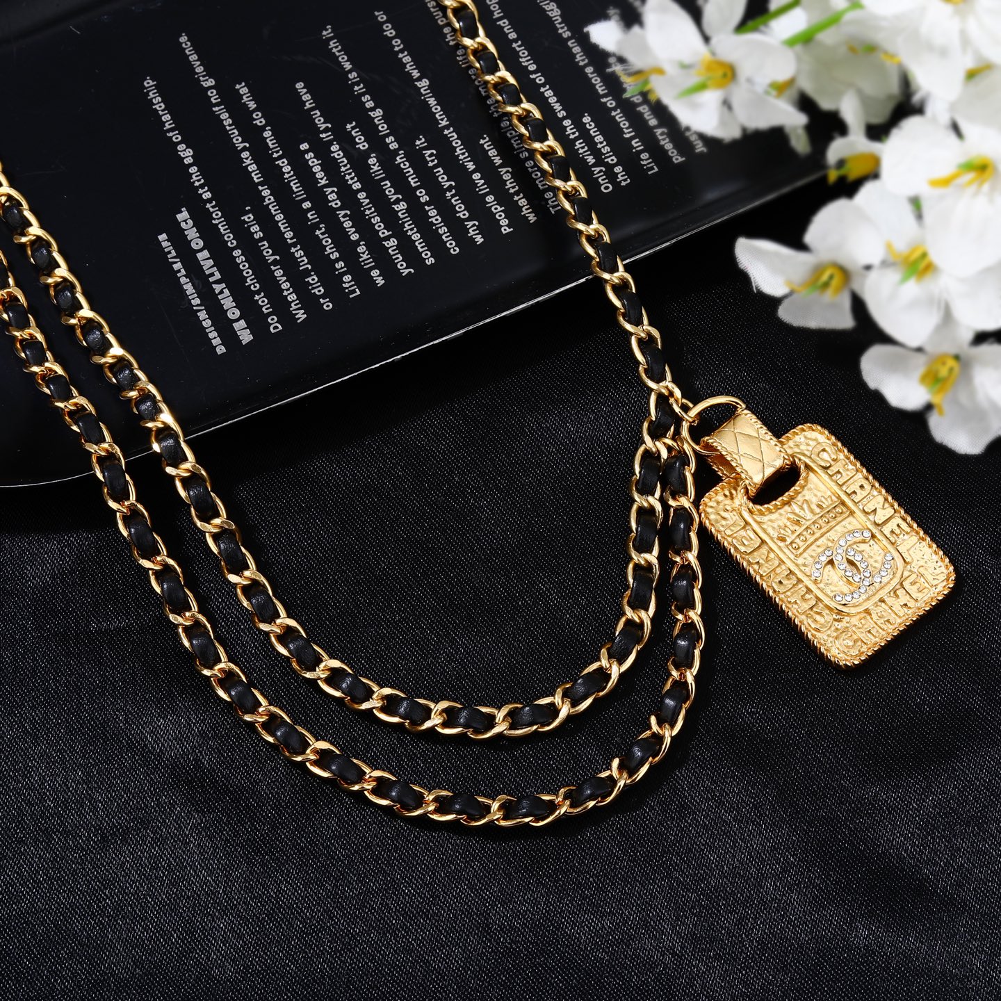 Chanel Goose series necklace gold-tone metal with black leather woven chain clear crystal accents on gold-tone pendant 80cm