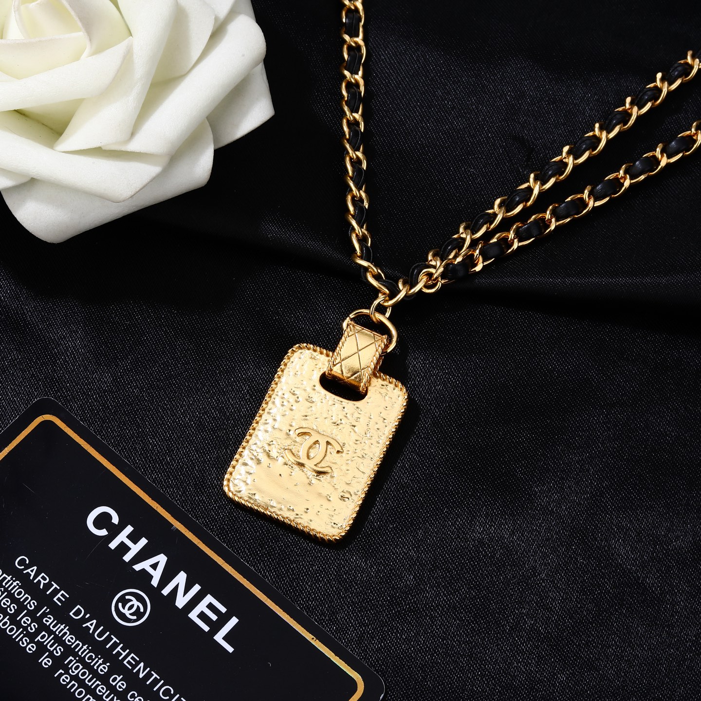 Chanel Goose series necklace gold-tone metal with black leather woven chain clear crystal accents on gold-tone pendant 80cm