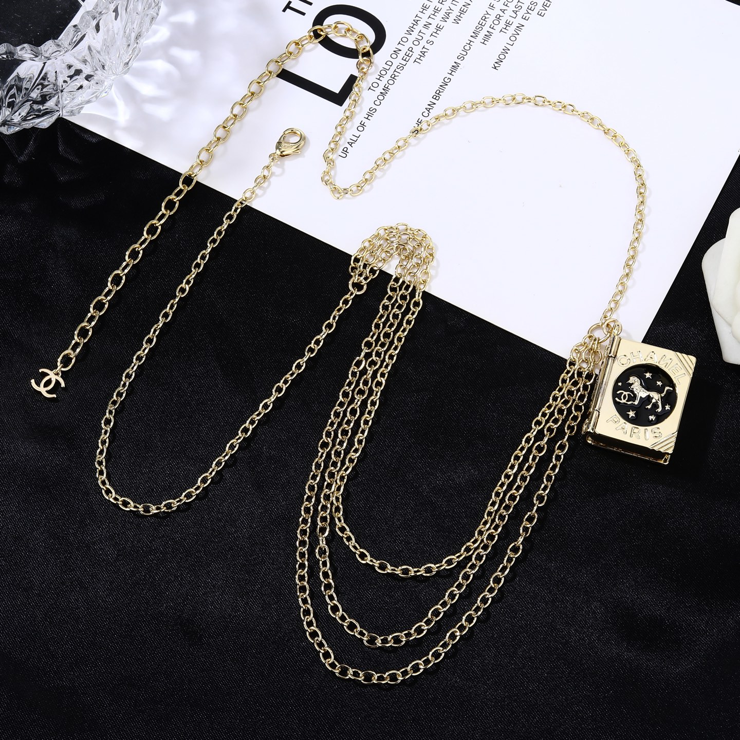 Chanel Goose series Lion Book Locket Waist Chain necklace Gold-tone metal with black enamel and silver-tone lion CC logo detailing 80cm