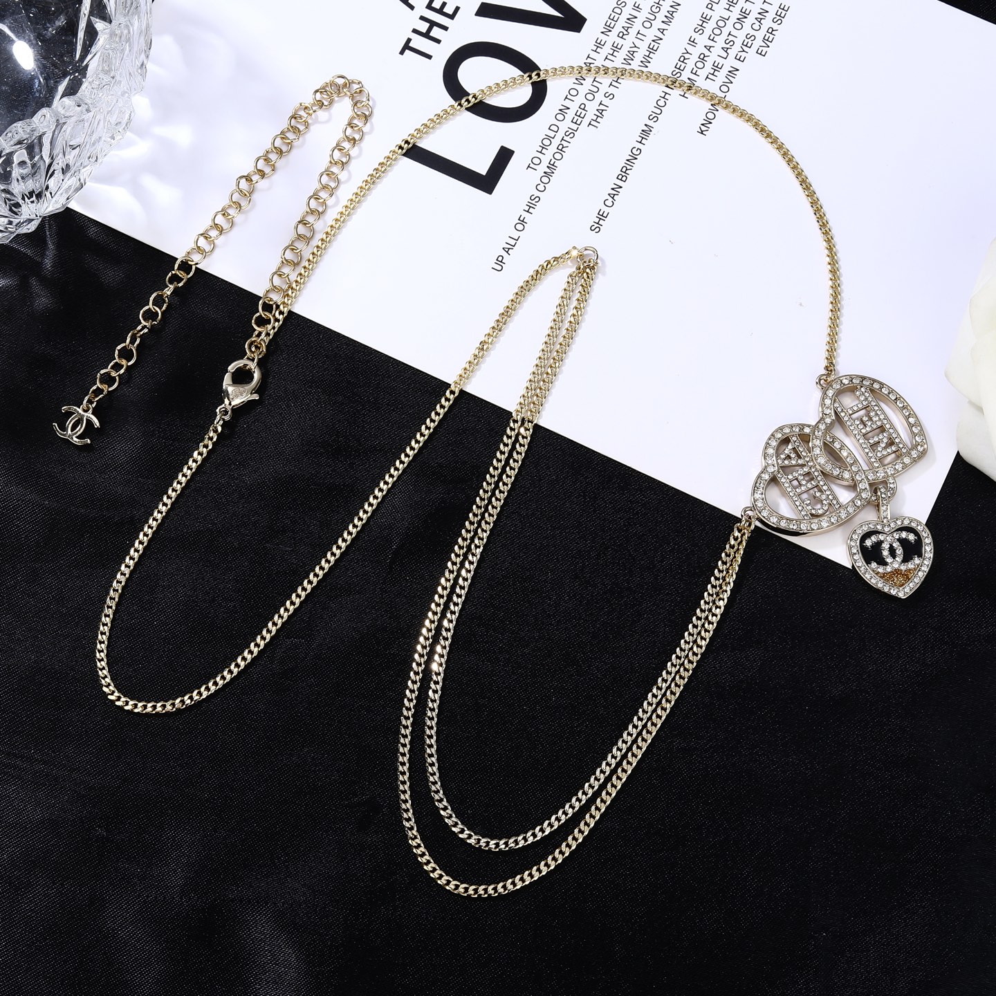 Chanel Goose Heart Logo Waist Chain necklace Gold-tone metal with clear crystal rhinestones black enamel and gold glitter accent on heart pendant 80cm with 5cm extension