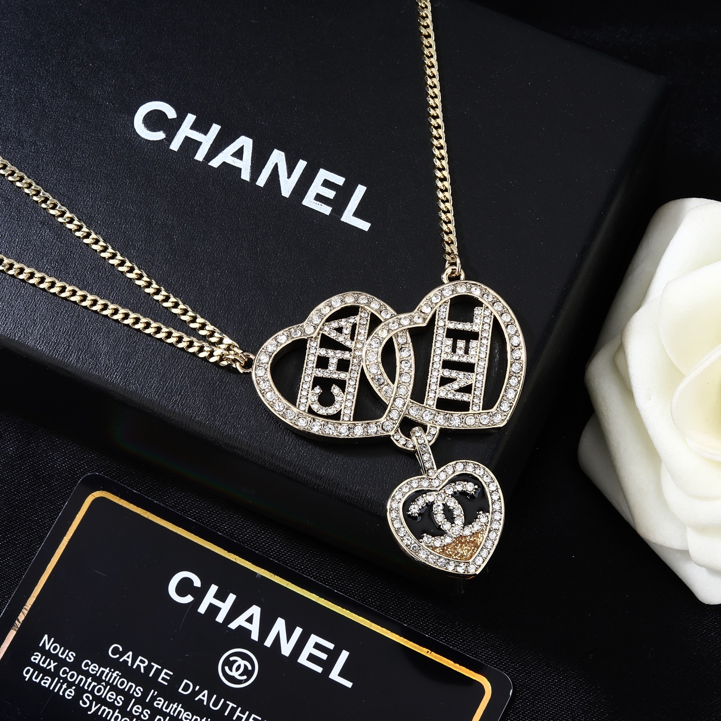 Chanel Goose Heart Logo Waist Chain necklace Gold-tone metal with clear crystal rhinestones black enamel and gold glitter accent on heart pendant 80cm with 5cm extension