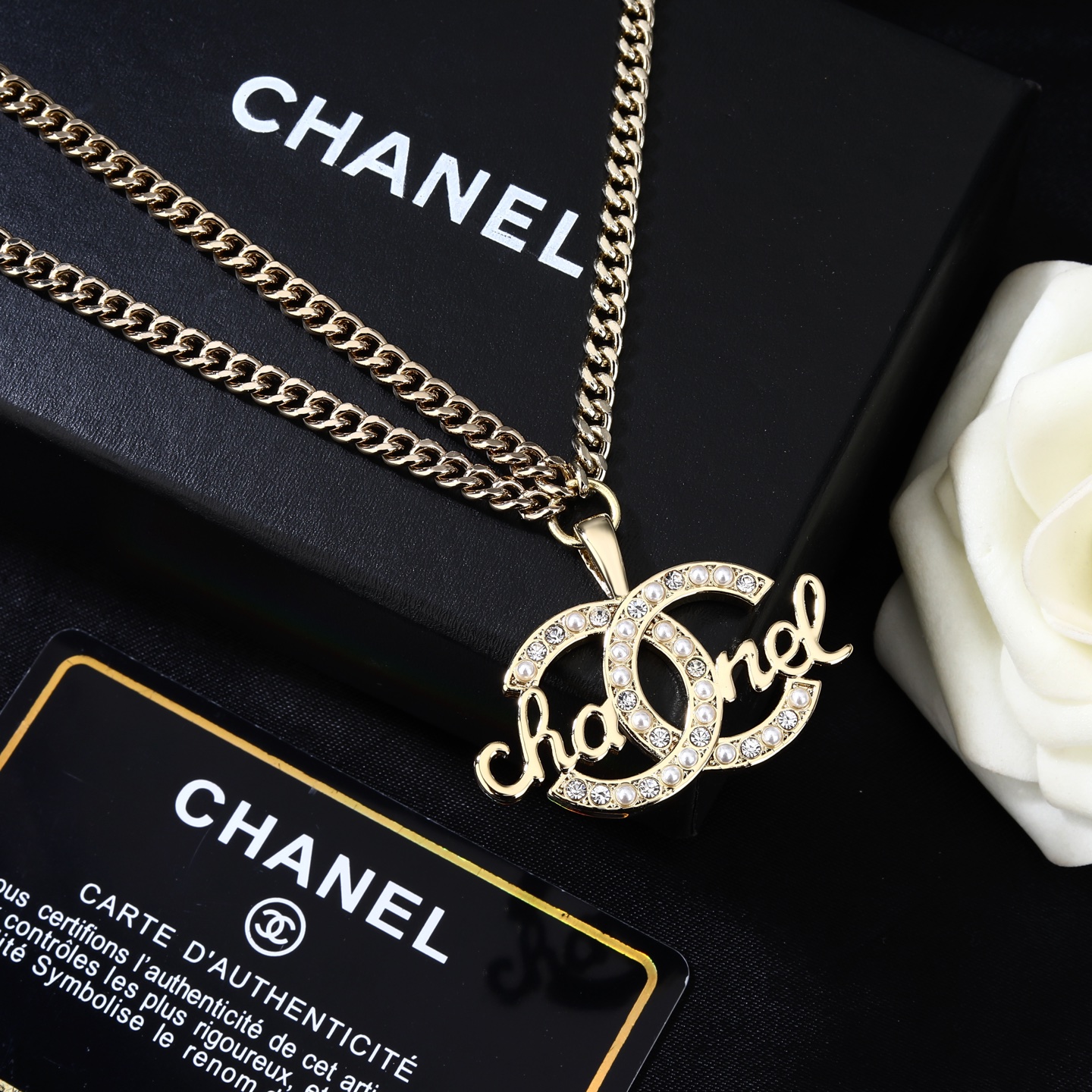 Chanel CC Script Crystal Pearl Waist Chain necklace Light gold metal with clear crystals and white pearl accents 80cm