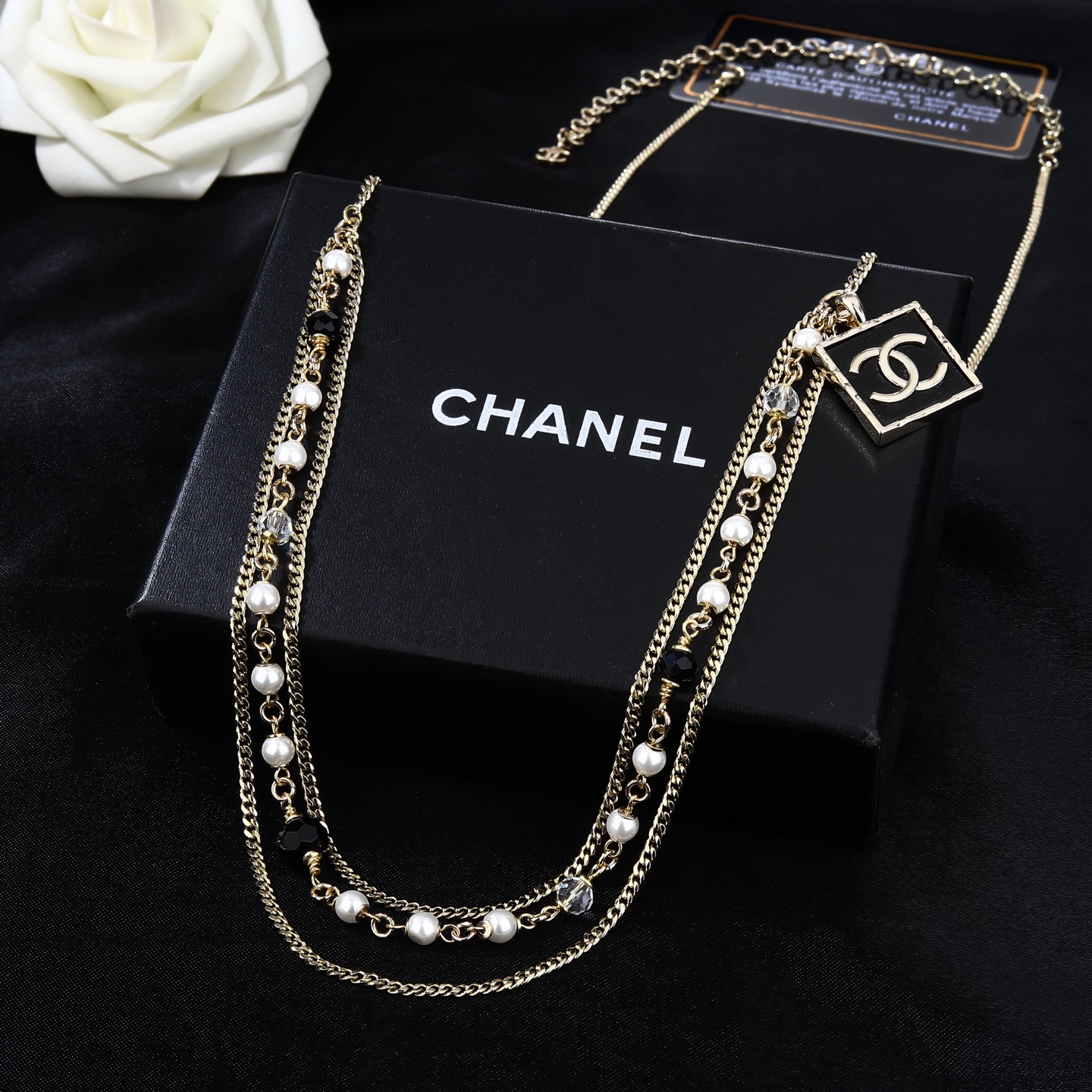 Chanel Goose Series CC Square Charm Pearl Beaded Waist Chain necklace Gold-tone metal with white faux pearls black faceted beads clear faceted beads and black enamel CC charm 80cm