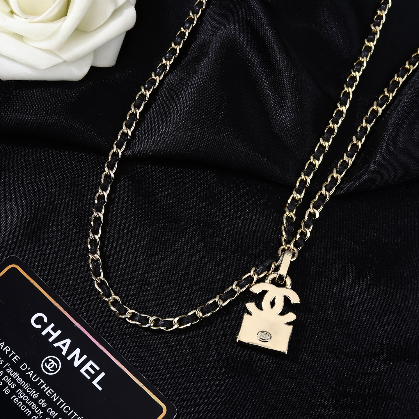 Chanel Goose series CC quilted bag charm chain necklace gold-tone metal with black leather inlay clear crystal accents 80cm
