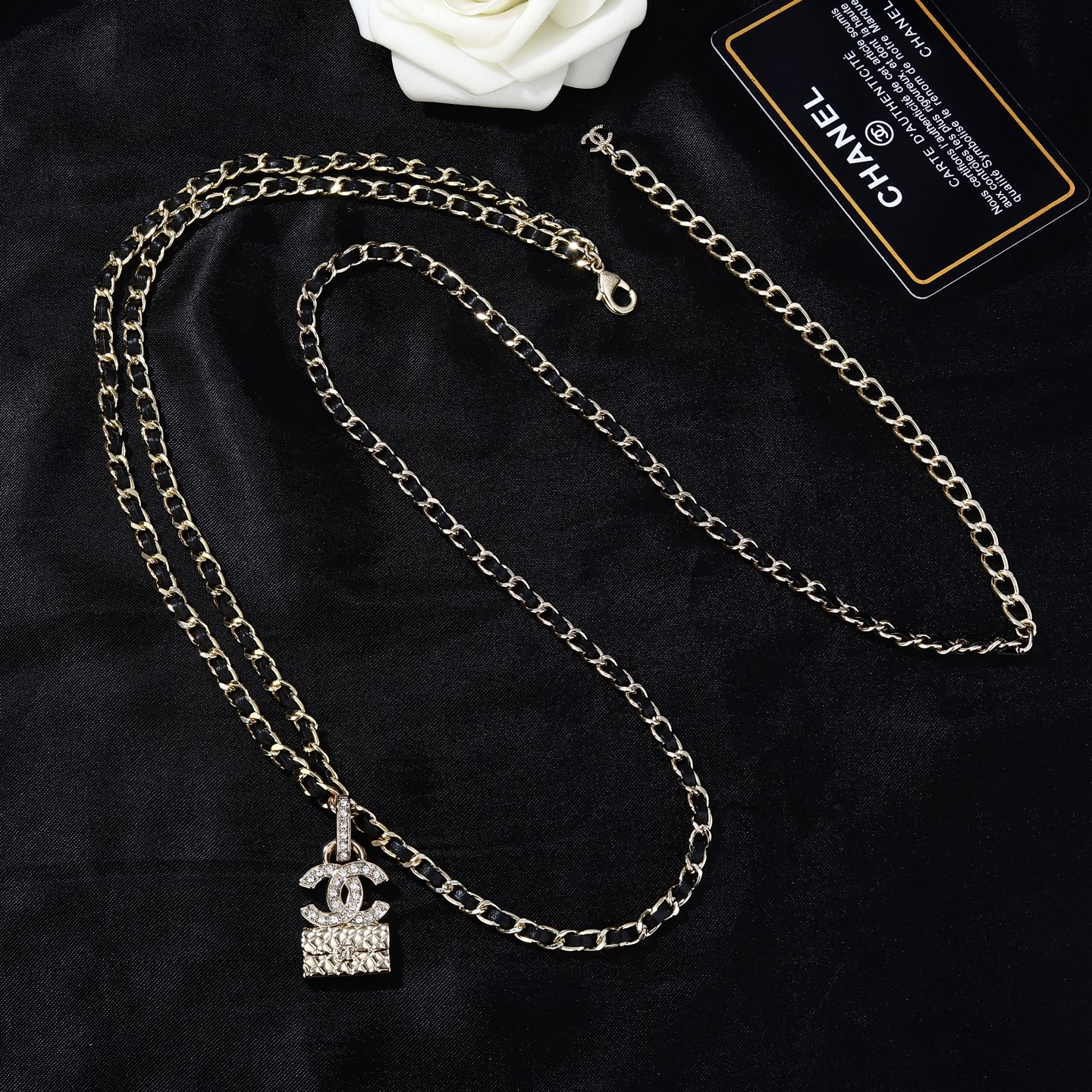 Chanel Goose series CC quilted bag charm chain necklace gold-tone metal with black leather inlay clear crystal accents 80cm