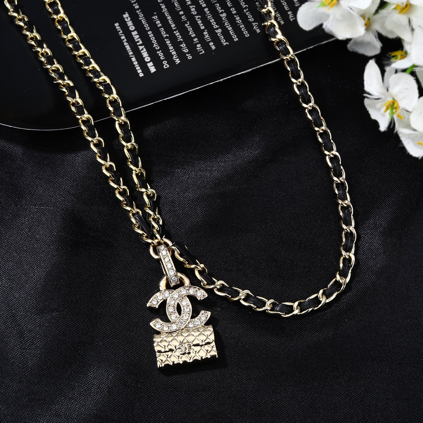 Chanel Goose series CC quilted bag charm chain necklace gold-tone metal with black leather inlay clear crystal accents 80cm