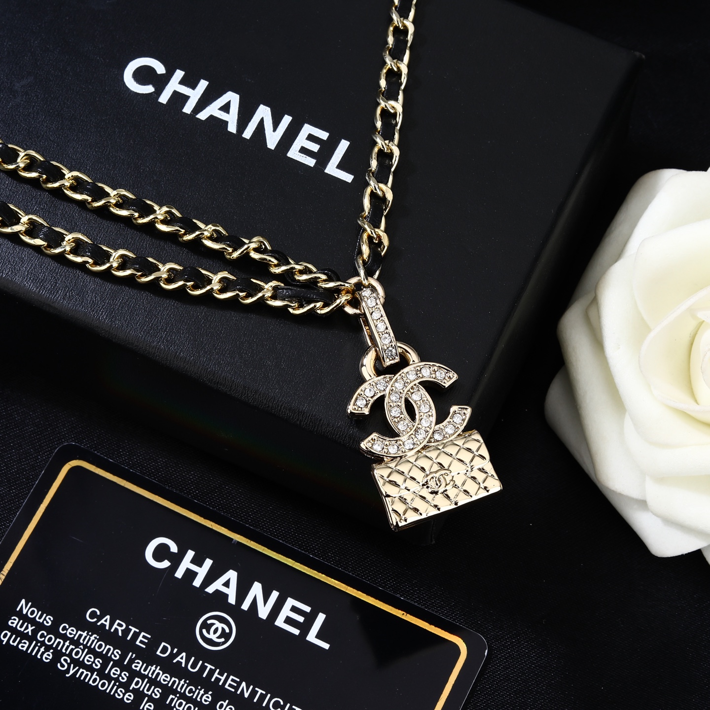 Chanel Goose series CC quilted bag charm chain necklace gold-tone metal with black leather inlay clear crystal accents 80cm