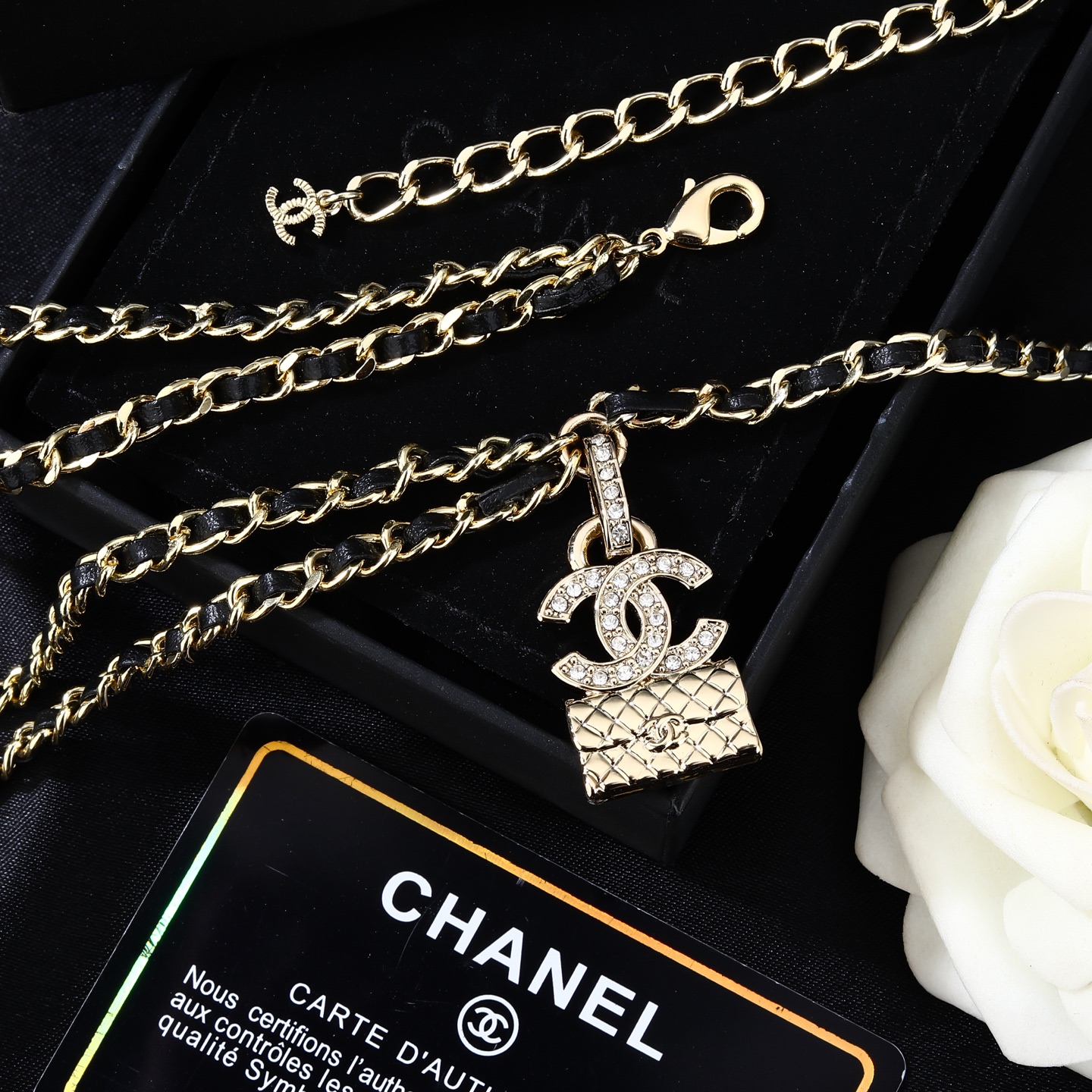 Chanel Goose series CC quilted bag charm chain necklace gold-tone metal with black leather inlay clear crystal accents 80cm