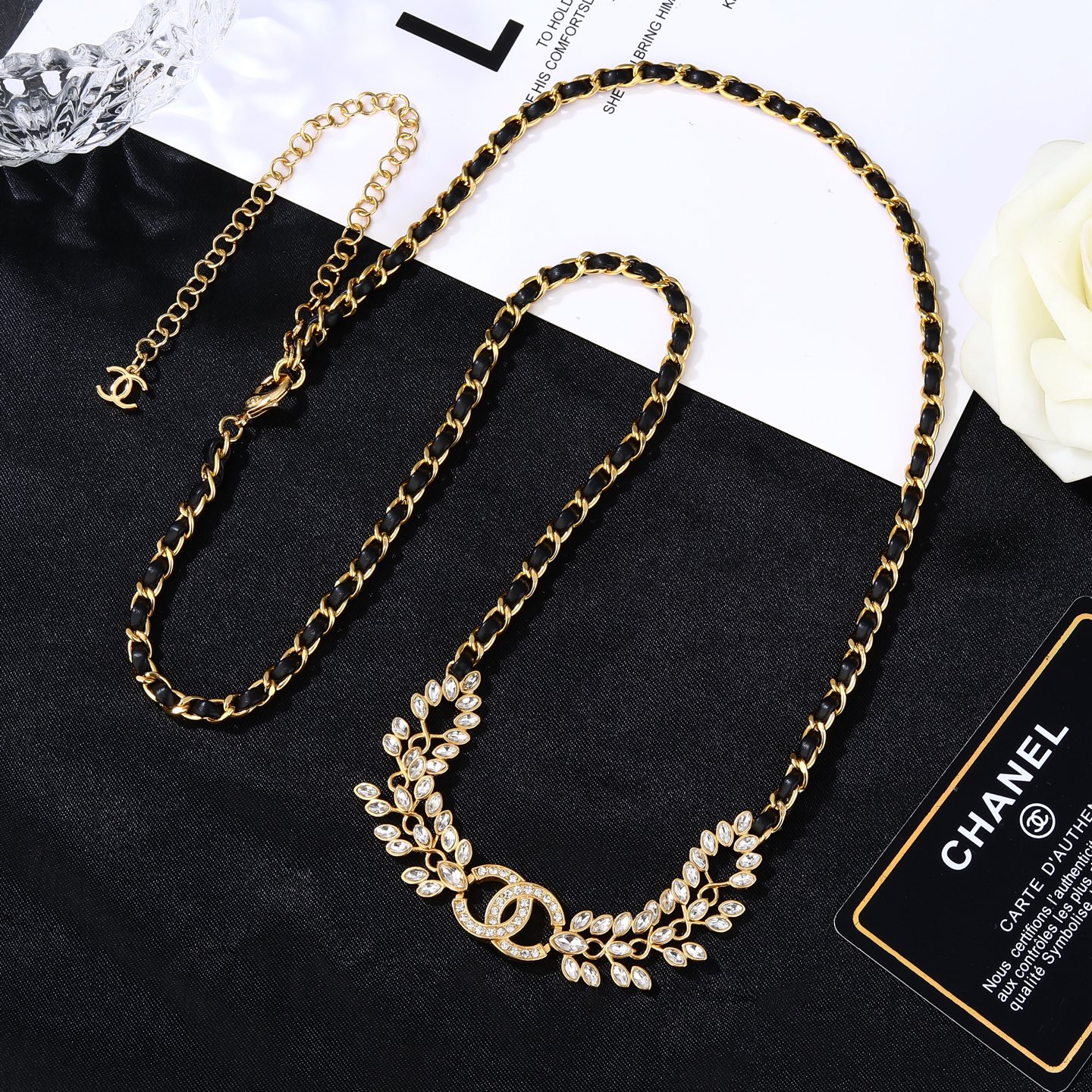 Chanel Goose series crystal leaf CC logo chain necklace gold tone metal with black leather woven chain clear faceted crystal stones 80cm