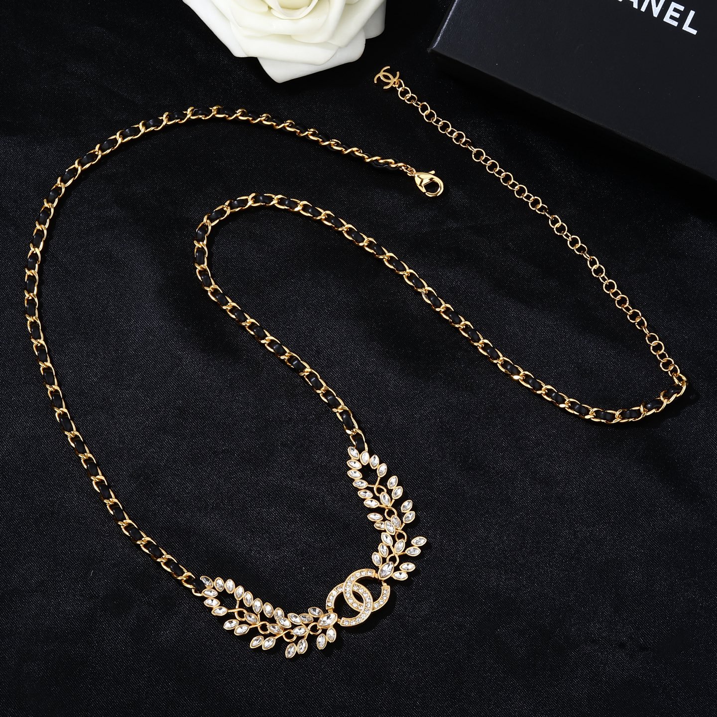 Chanel Goose series crystal leaf CC logo chain necklace gold tone metal with black leather woven chain clear faceted crystal stones 80cm