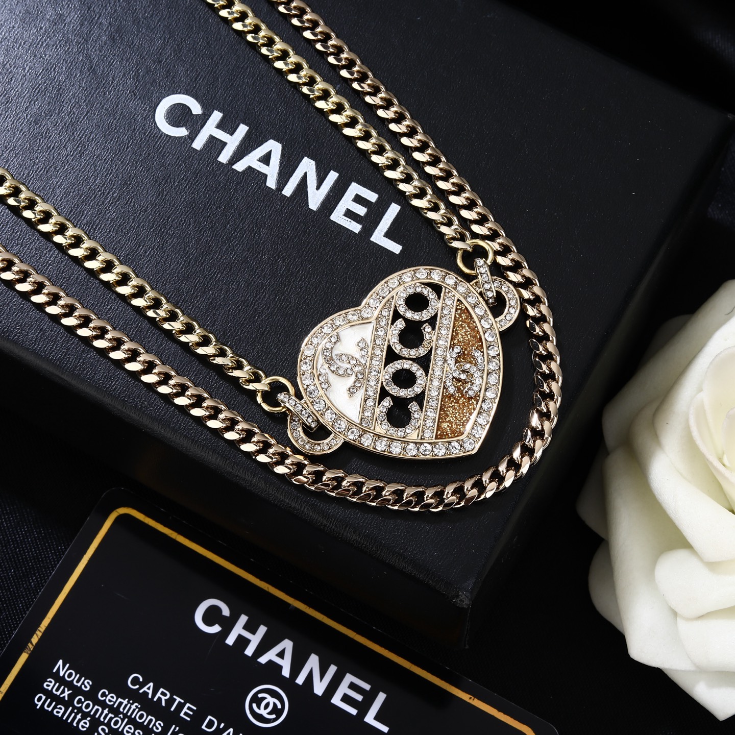 Chanel Coco Heart Waist Chain necklace Light gold tone metal with clear crystal and champagne glitter accents white enamel detail 80cm with 15cm extension