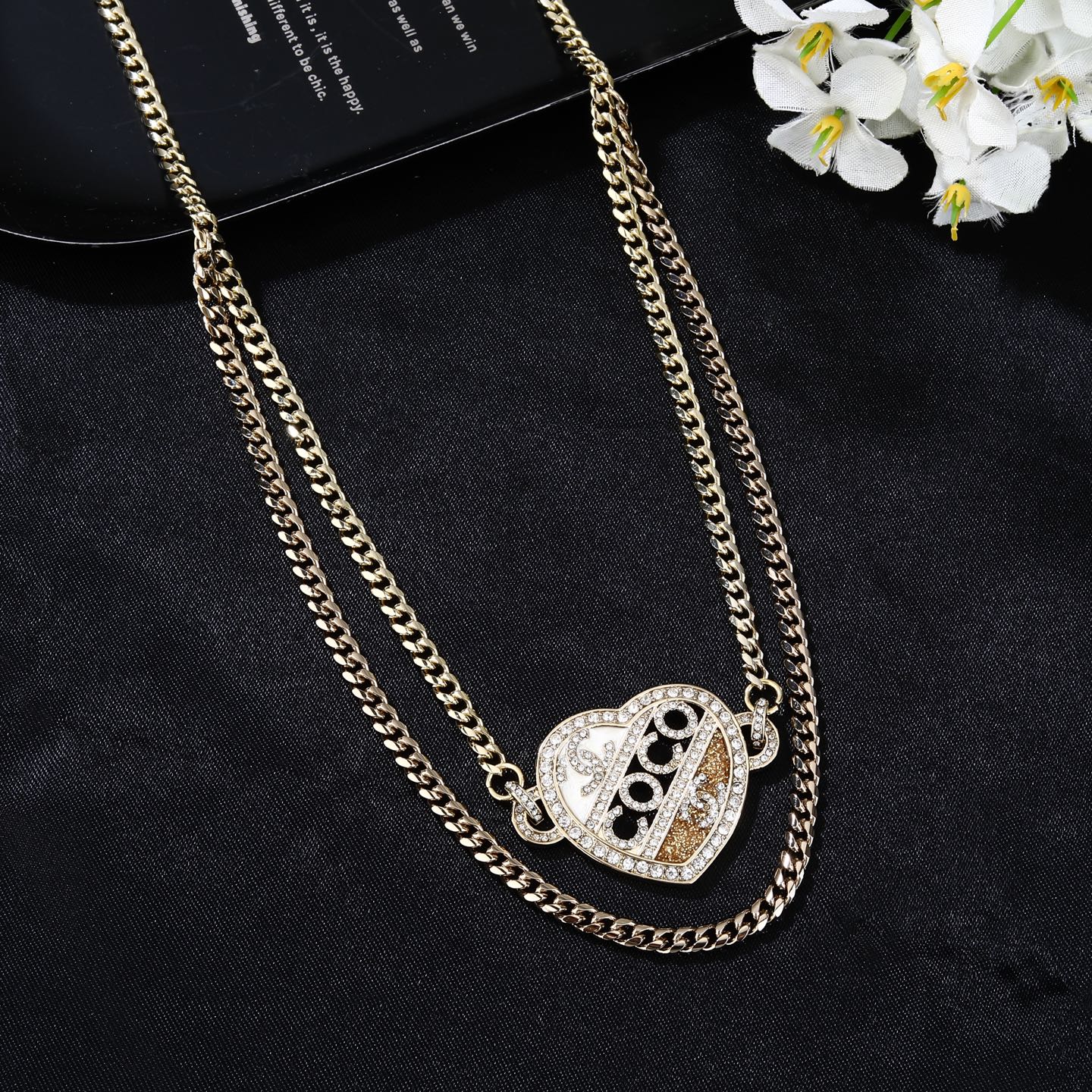 Chanel Coco Heart Waist Chain necklace Light gold tone metal with clear crystal and champagne glitter accents white enamel detail 80cm with 15cm extension