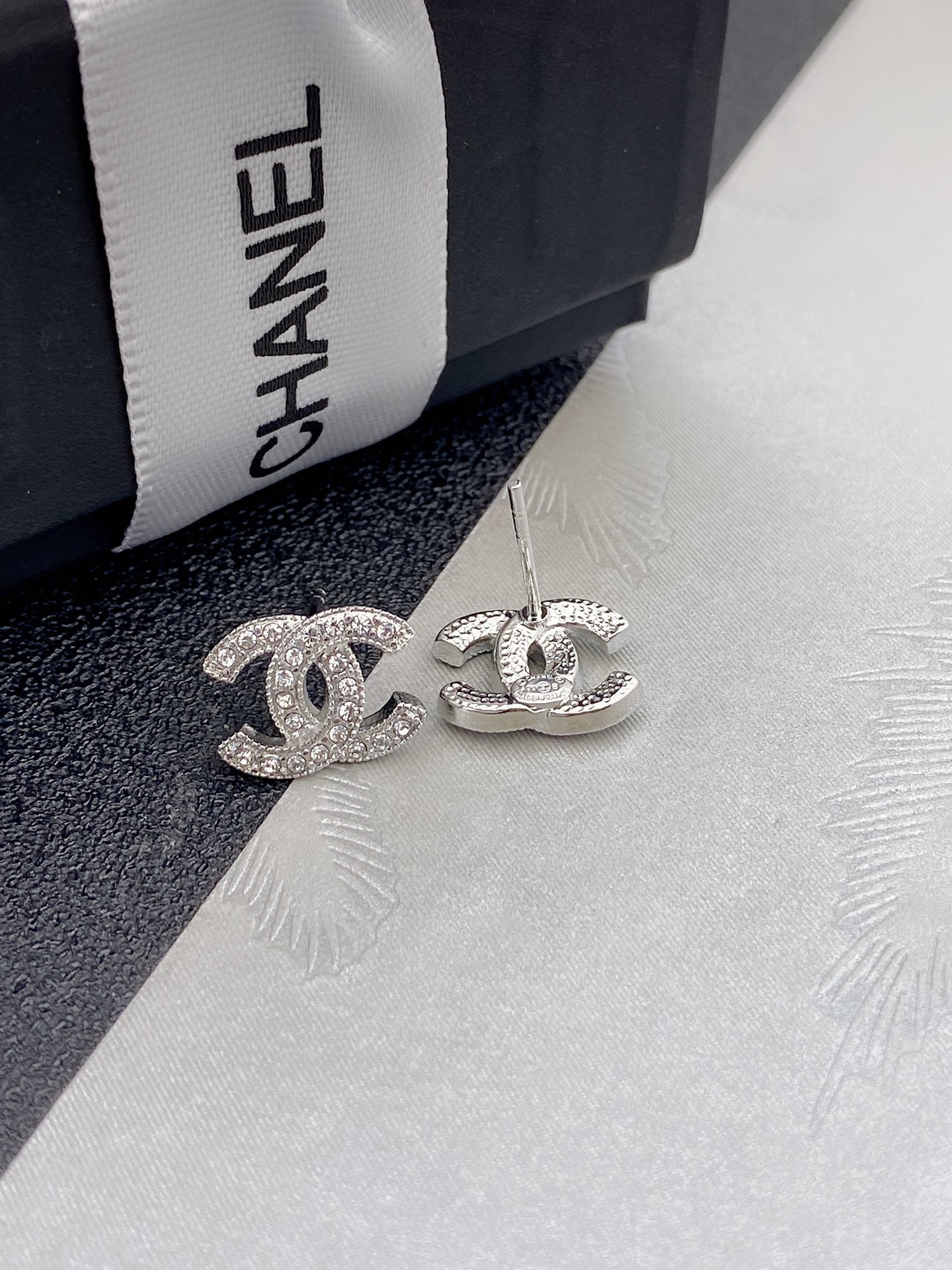 Chanel CC Crystal Stud Earrings earrings silver-tone metal with clear crystals gold-tone metal with clear crystals 1cm diameter