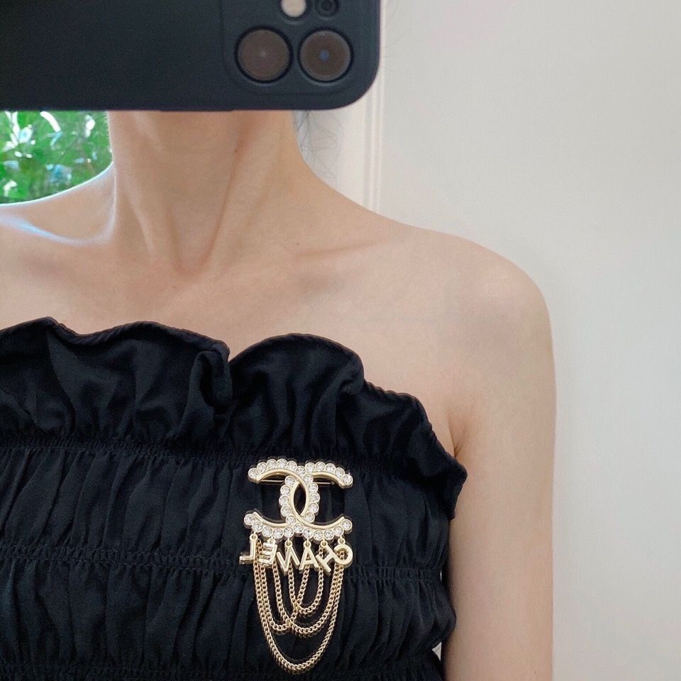 Chanel CC Logo Letter Chain Fringe Brooch brooch Gold-tone metal with clear faceted crystal accents Approximately 6cm width 9cm total drop length with chains