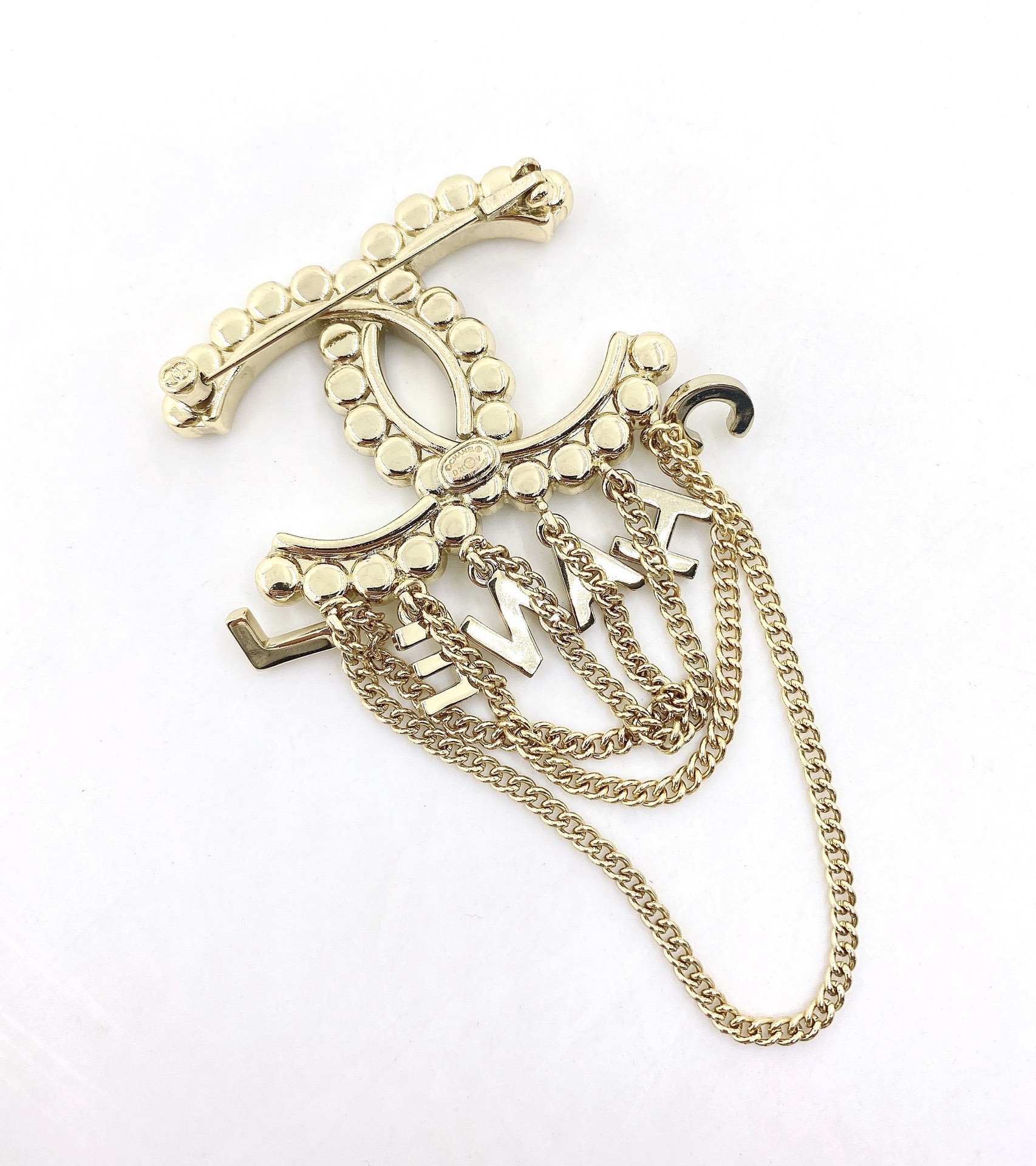 Chanel CC Logo Letter Chain Fringe Brooch brooch Gold-tone metal with clear faceted crystal accents Approximately 6cm width 9cm total drop length with chains