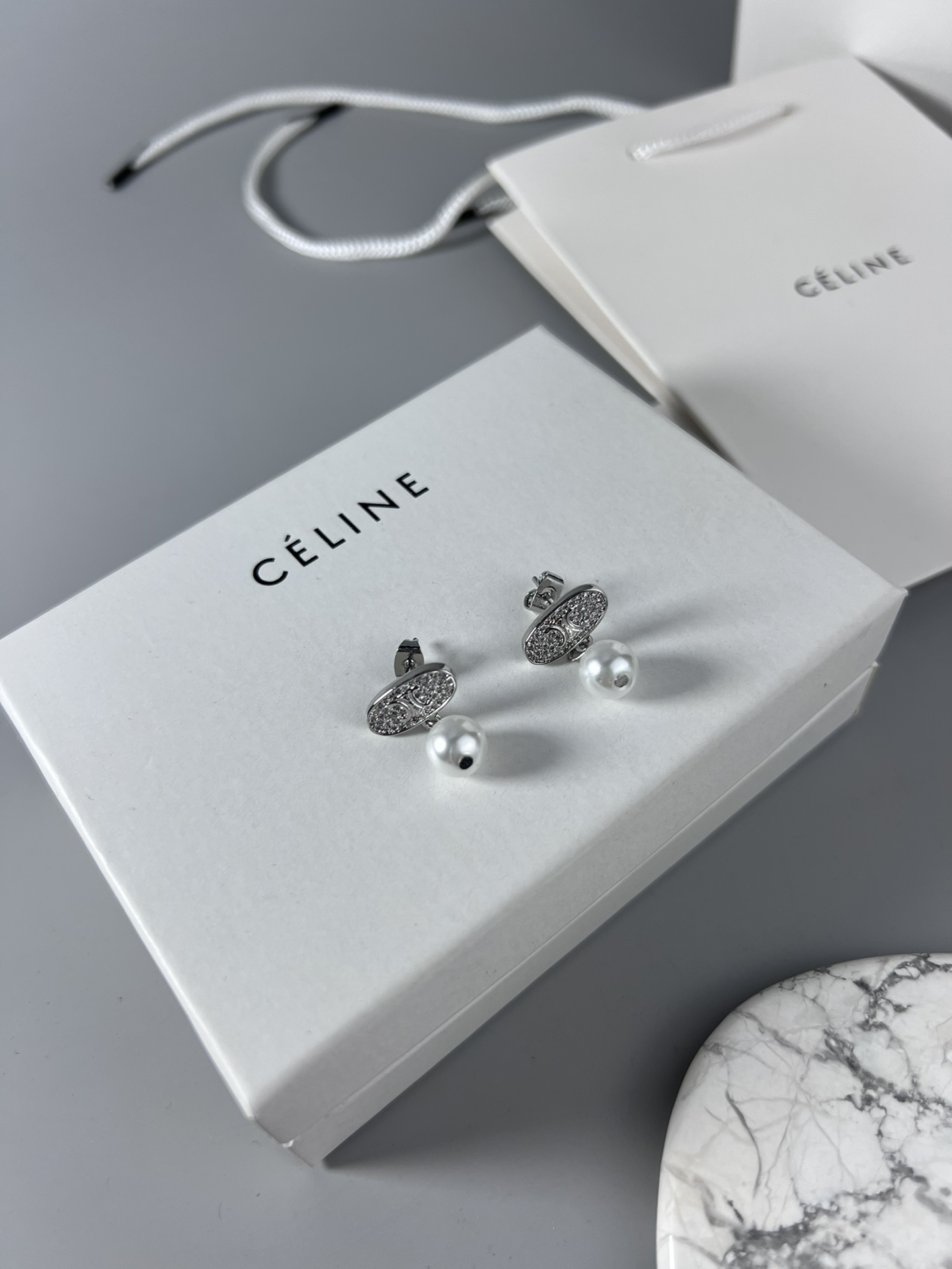 Celine Triomphe Pearl Stud Earrings earrings Gold-tone metal with clear pave crystals and white pearl accents 1 5cm stud diameter