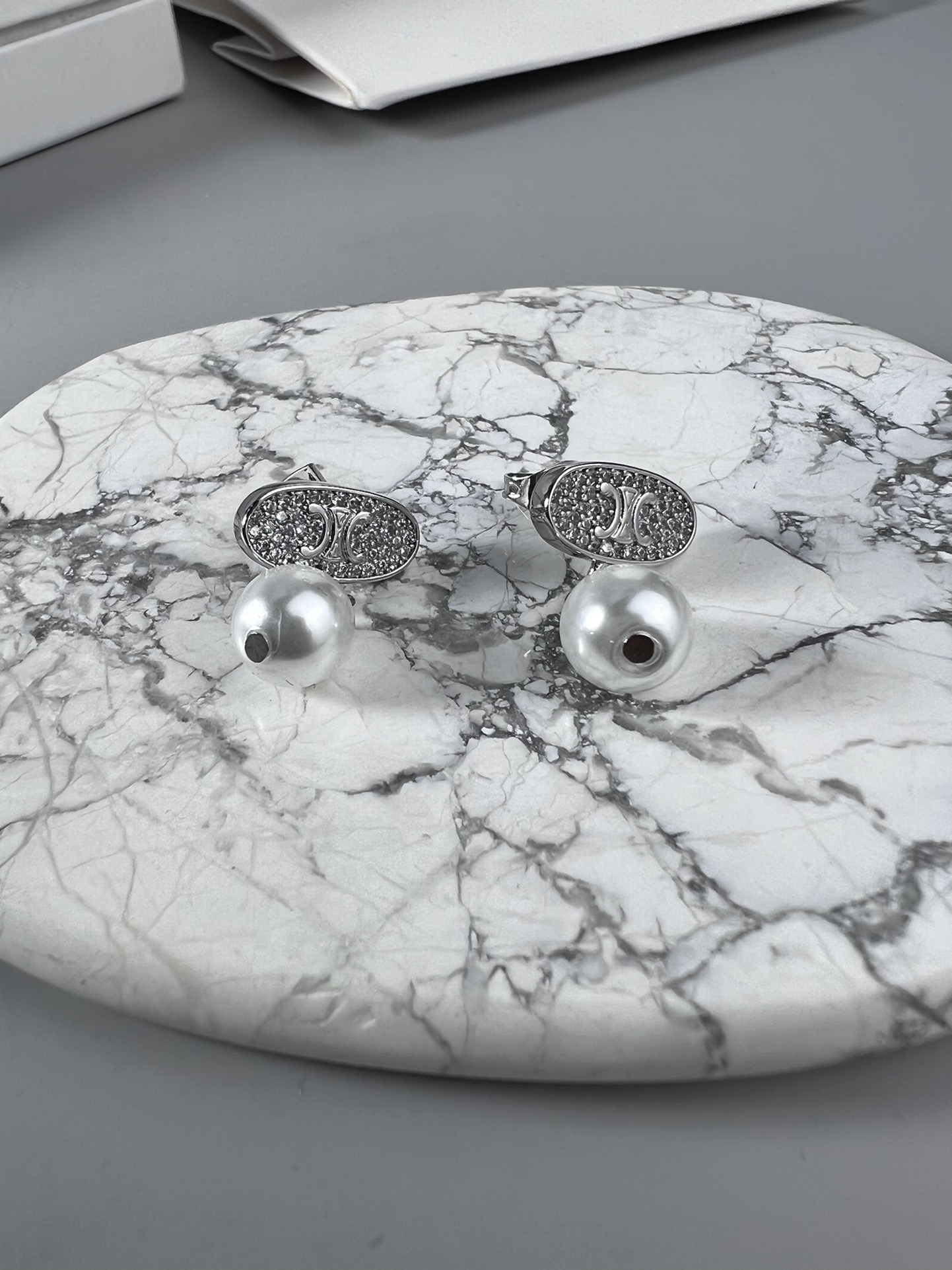 Celine Triomphe Pearl Stud Earrings earrings Gold-tone metal with clear pave crystals and white pearl accents 1 5cm stud diameter