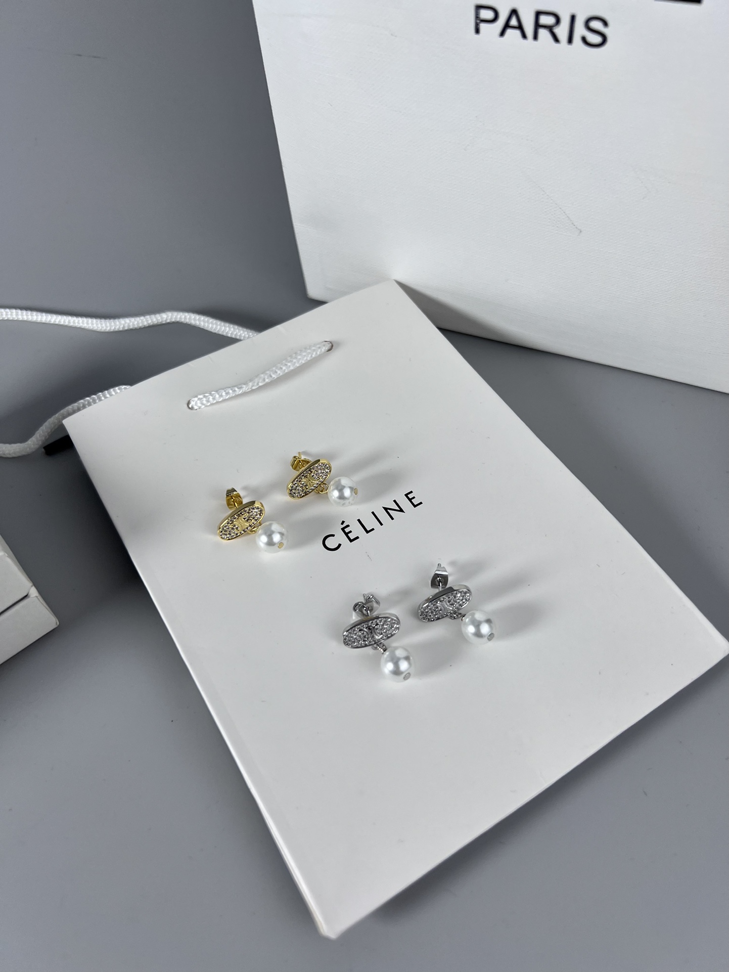Celine Triomphe Pearl Stud Earrings earrings Gold-tone metal with clear pave crystals and white pearl accents 1 5cm stud diameter