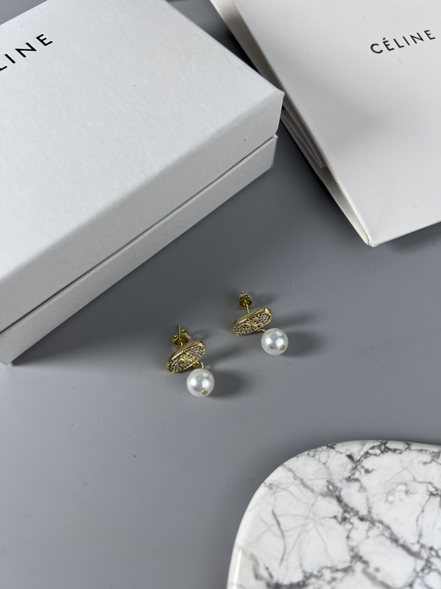 Celine Triomphe Pearl Stud Earrings earrings Gold-tone metal with clear pave crystals and white pearl accents 1 5cm stud diameter