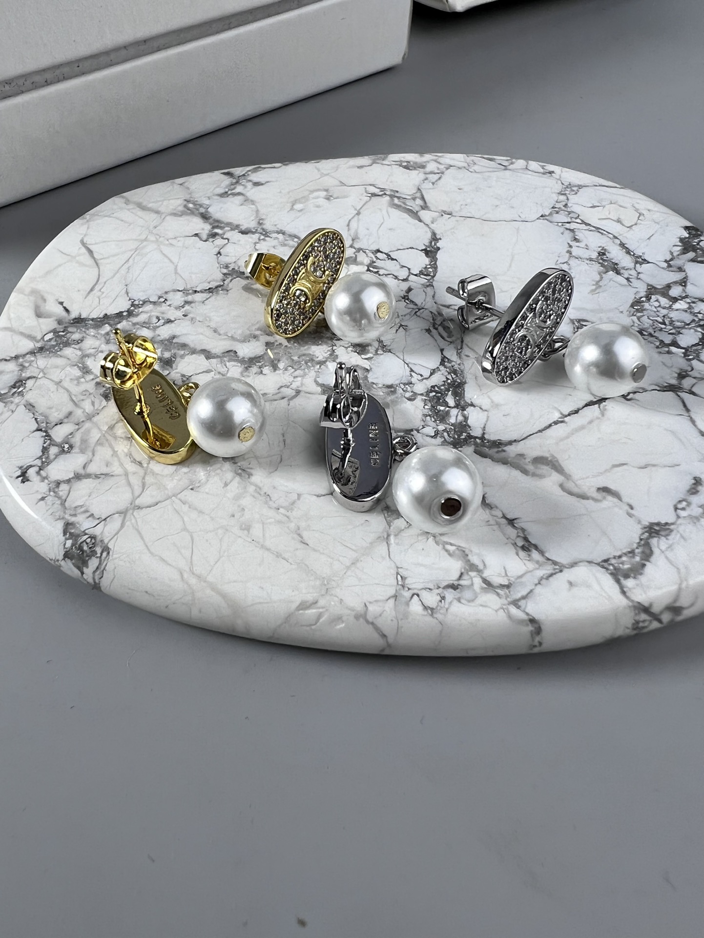 Celine Triomphe Pearl Stud Earrings earrings Gold-tone metal with clear pave crystals and white pearl accents 1 5cm stud diameter