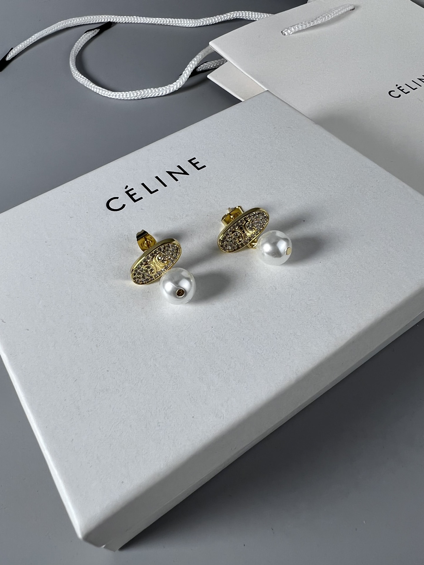Celine Triomphe Pearl Stud Earrings earrings Gold-tone metal with clear pave crystals and white pearl accents 1 5cm stud diameter