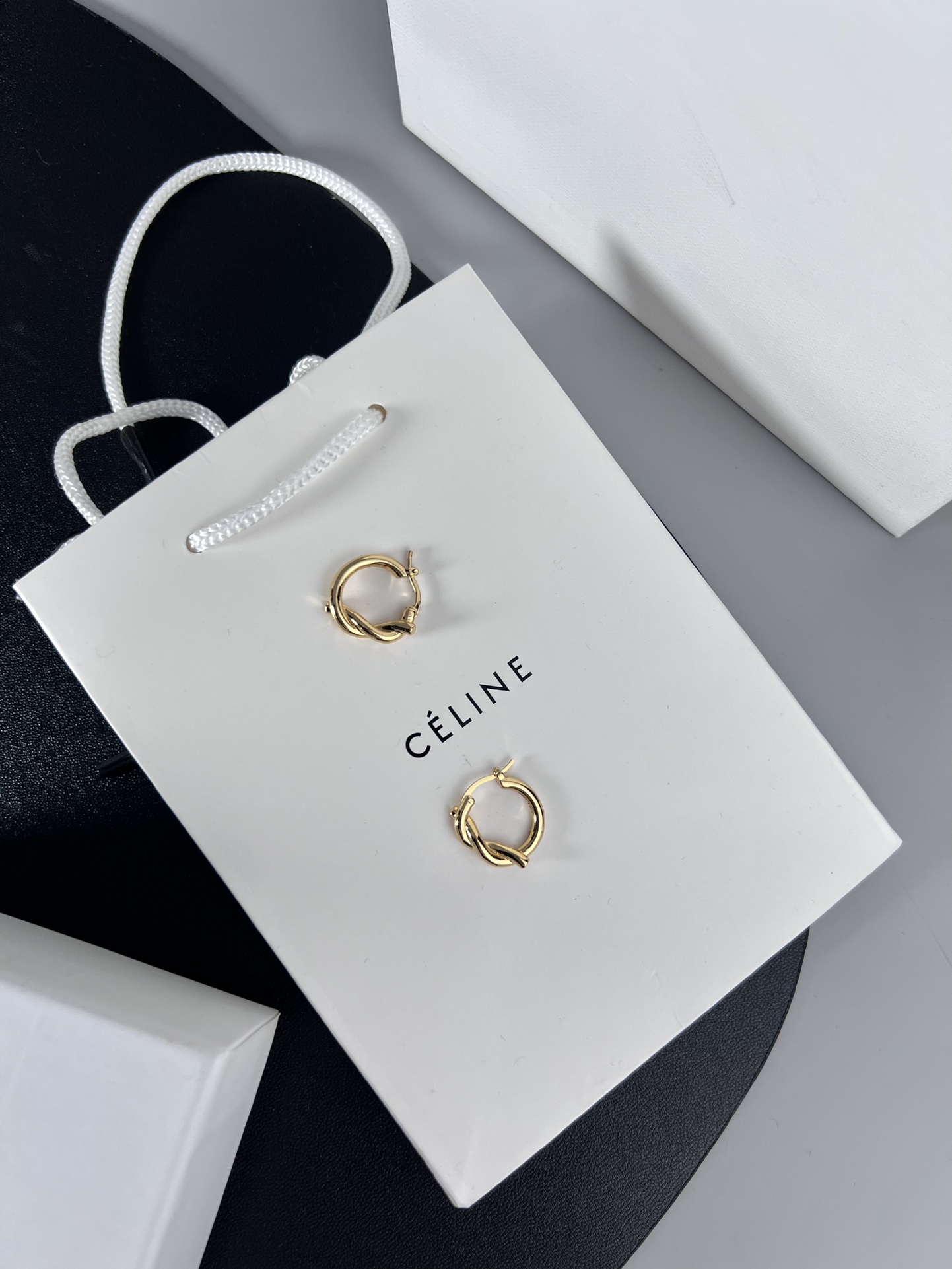 Celine YHED045 Twist Hoop earrings Gold-tone metal first variant Silver-tone metal second and third variants no gemstones 2cm diameter