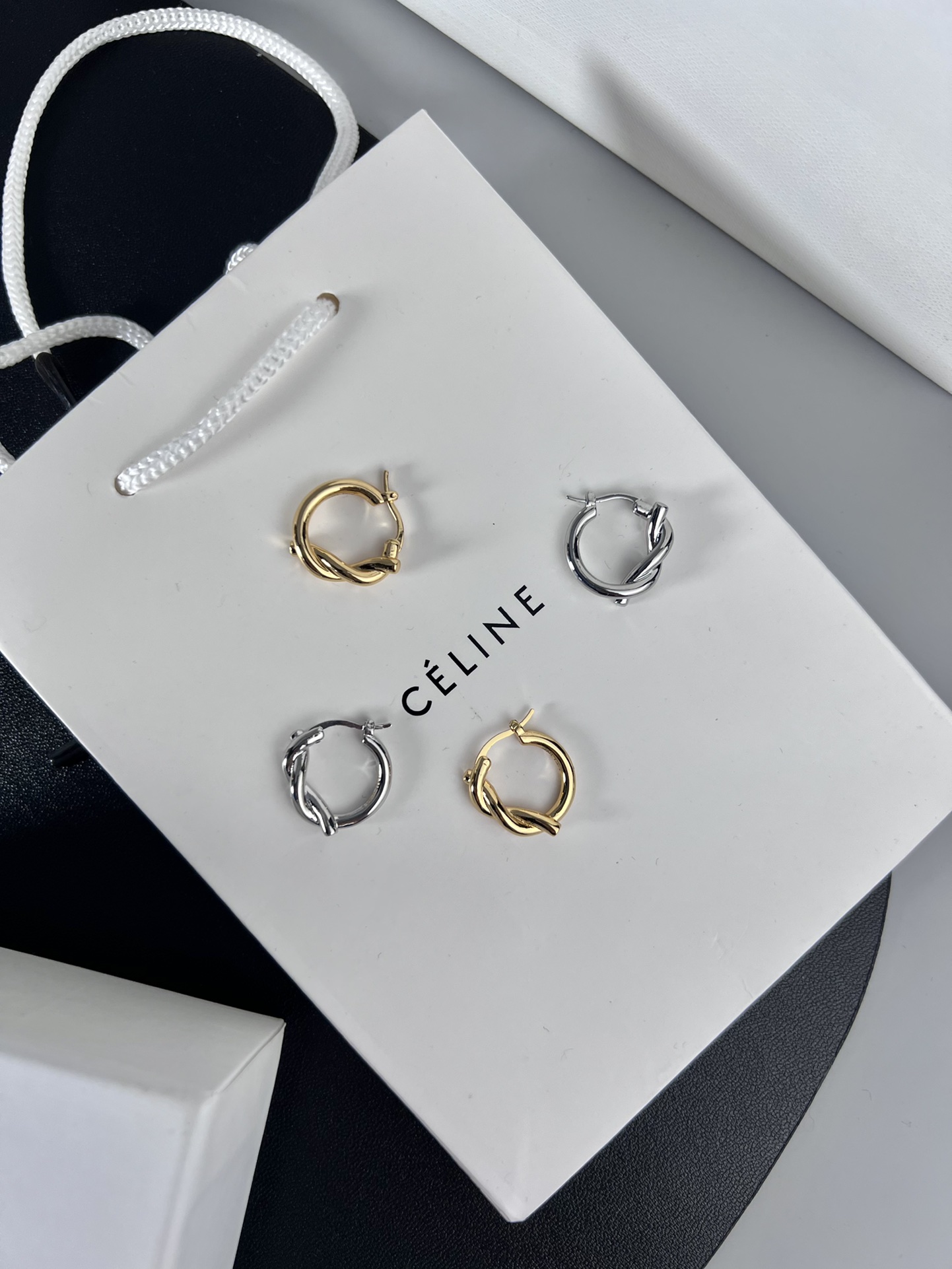 Celine YHED045 Twist Hoop earrings Gold-tone metal first variant Silver-tone metal second and third variants no gemstones 2cm diameter