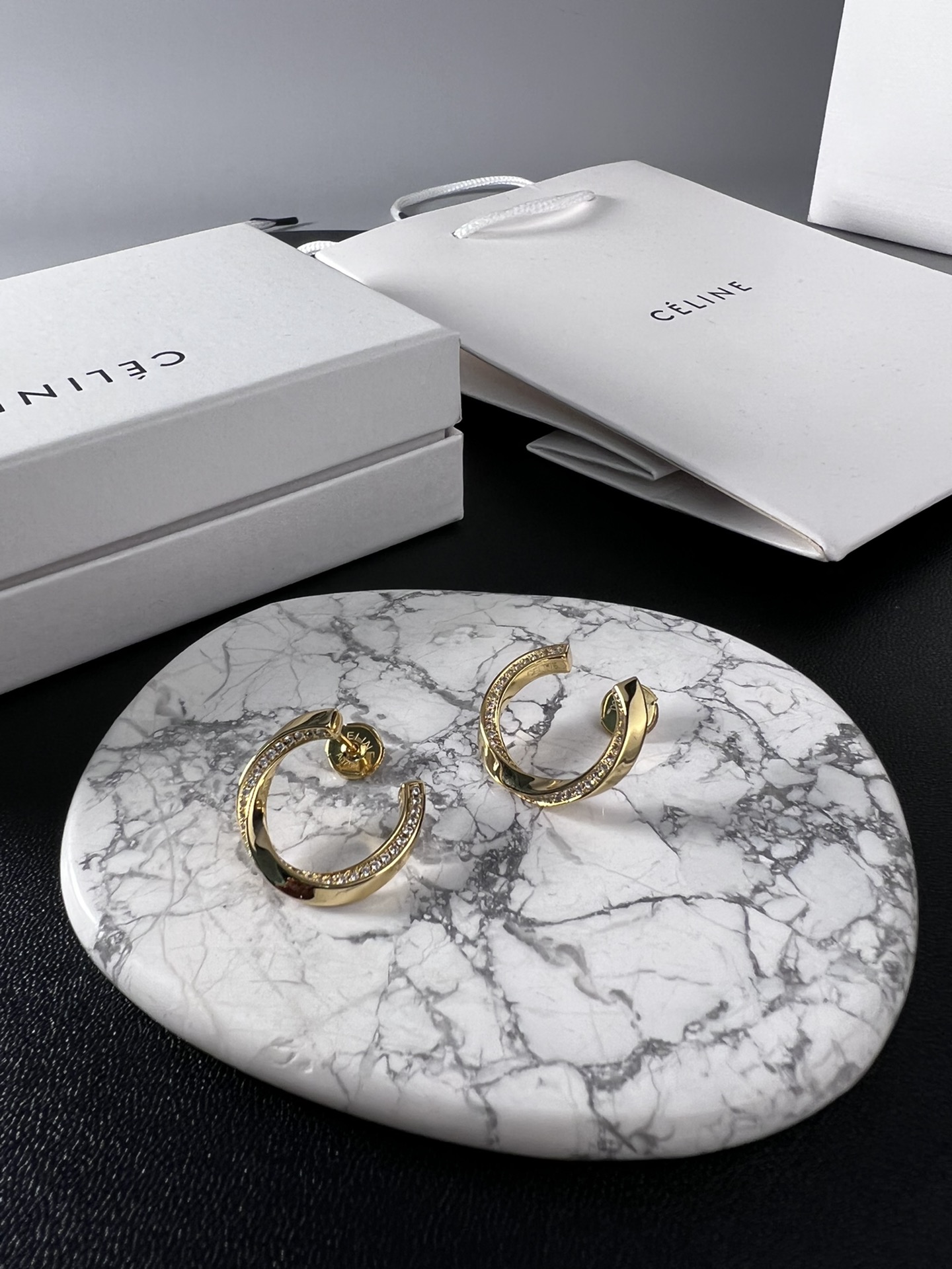 Celine YHED065 Twisted Crystal Hoop Earrings earrings gold-tone metal with clear crystal accents 2 5cm outer hoop diameter