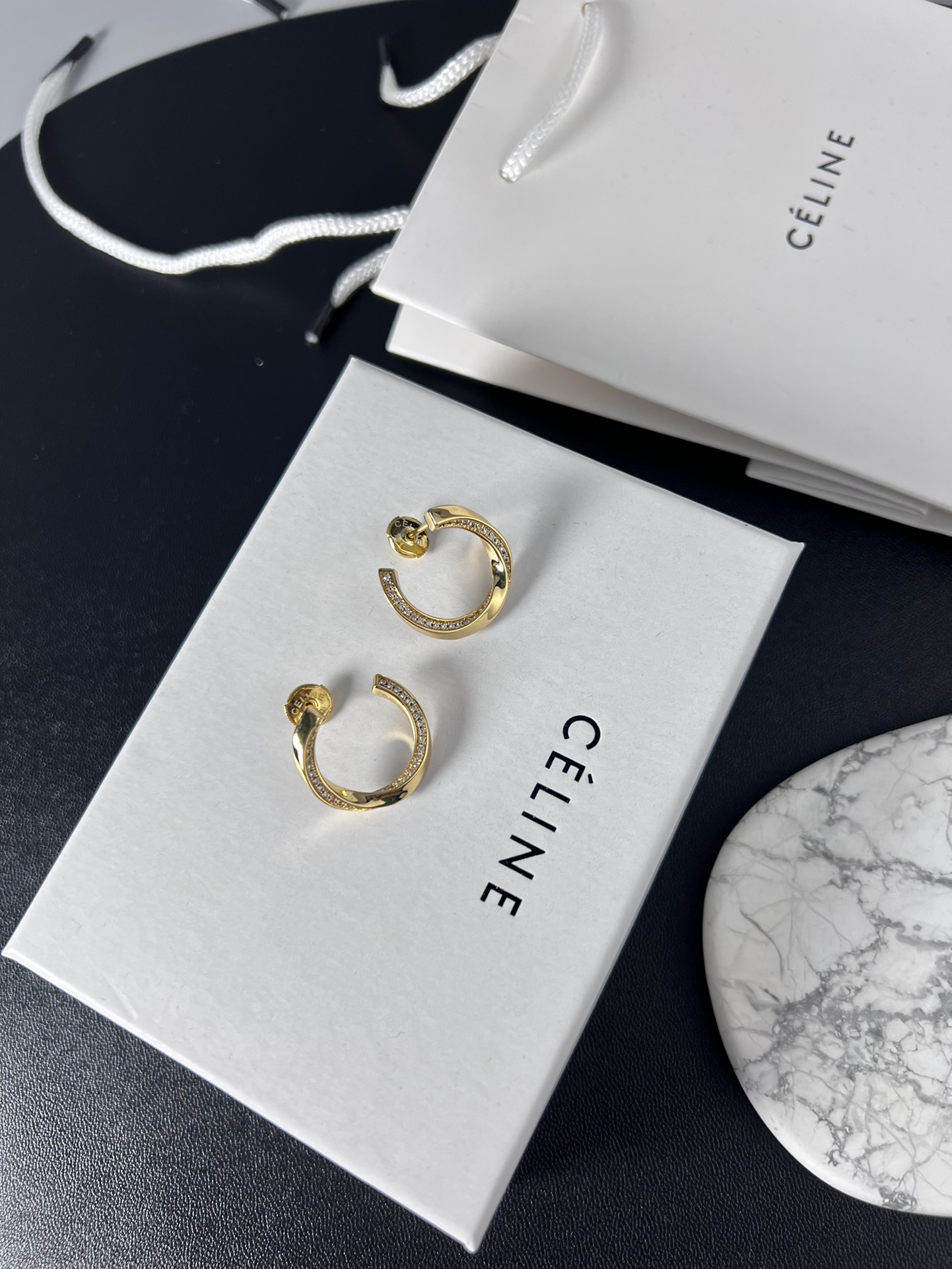 Celine YHED065 Twisted Crystal Hoop Earrings earrings gold-tone metal with clear crystal accents 2 5cm outer hoop diameter