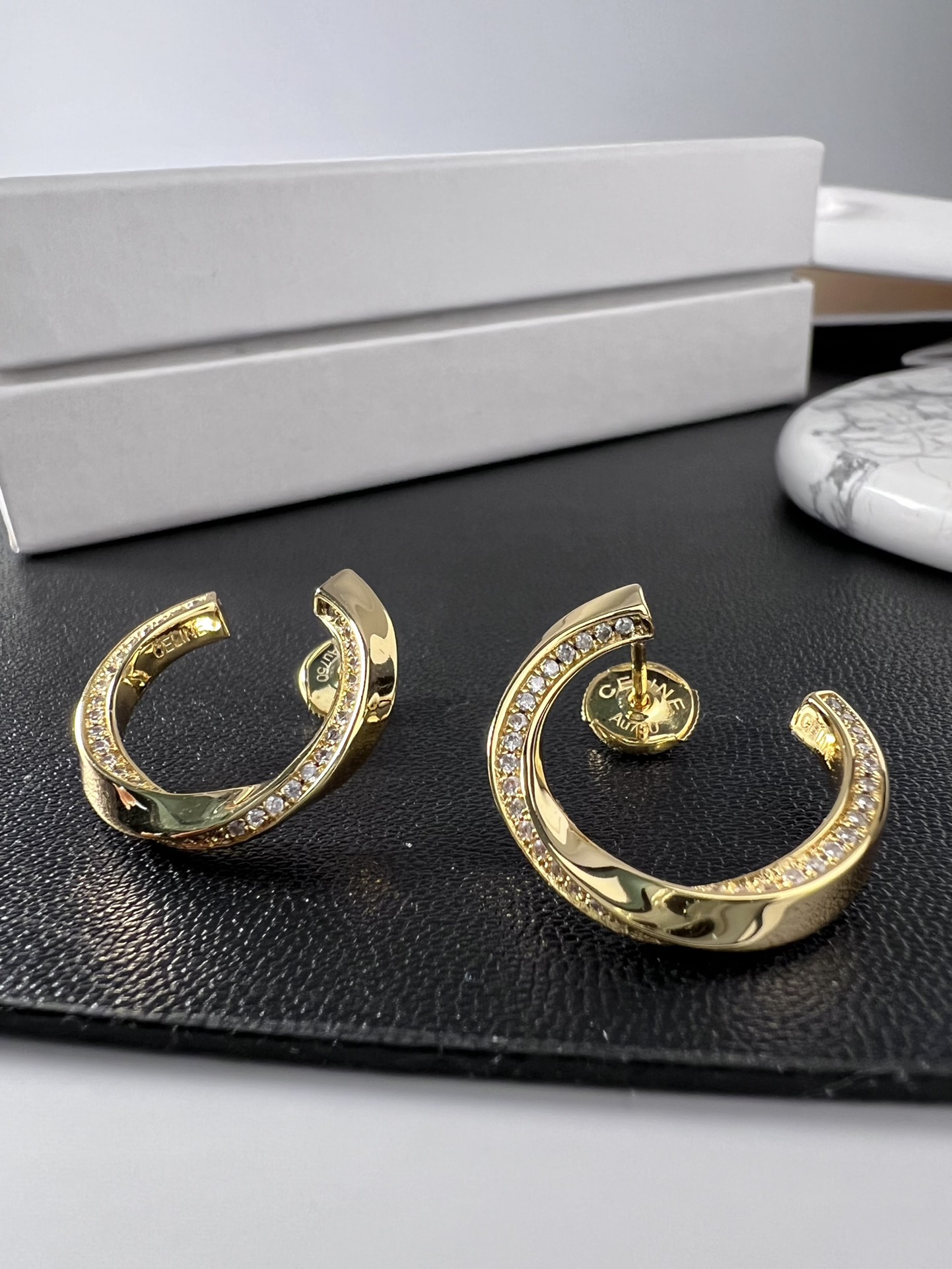 Celine YHED065 Twisted Crystal Hoop Earrings earrings gold-tone metal with clear crystal accents 2 5cm outer hoop diameter